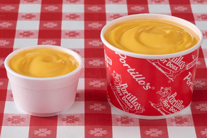 Order Cheese Sauce food online from Portillo Hot Dogs store, Naperville on bringmethat.com