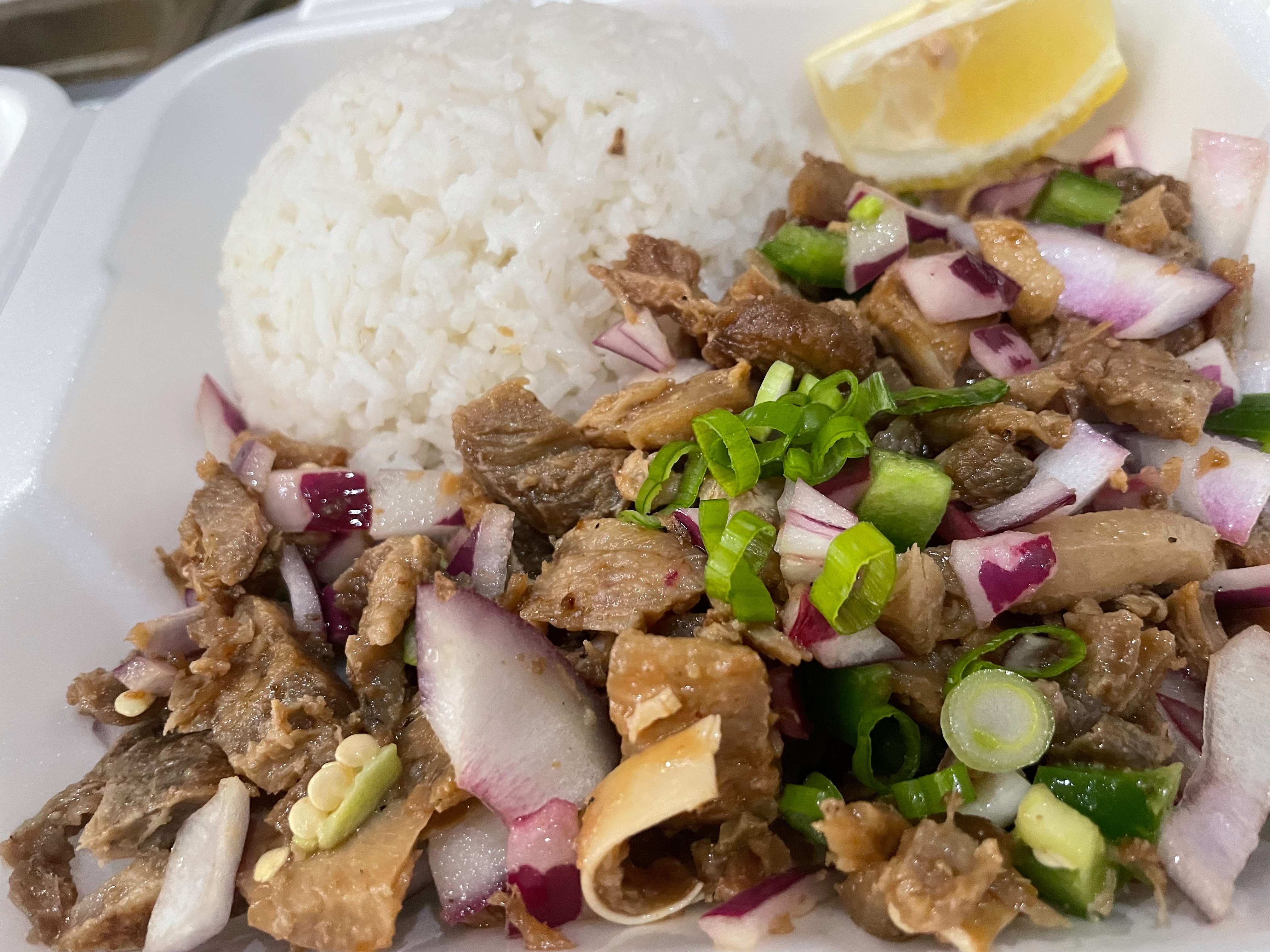 Order Pork Sisig with rice food online from Apong's Philly Steak store, Rancho Mirage on bringmethat.com
