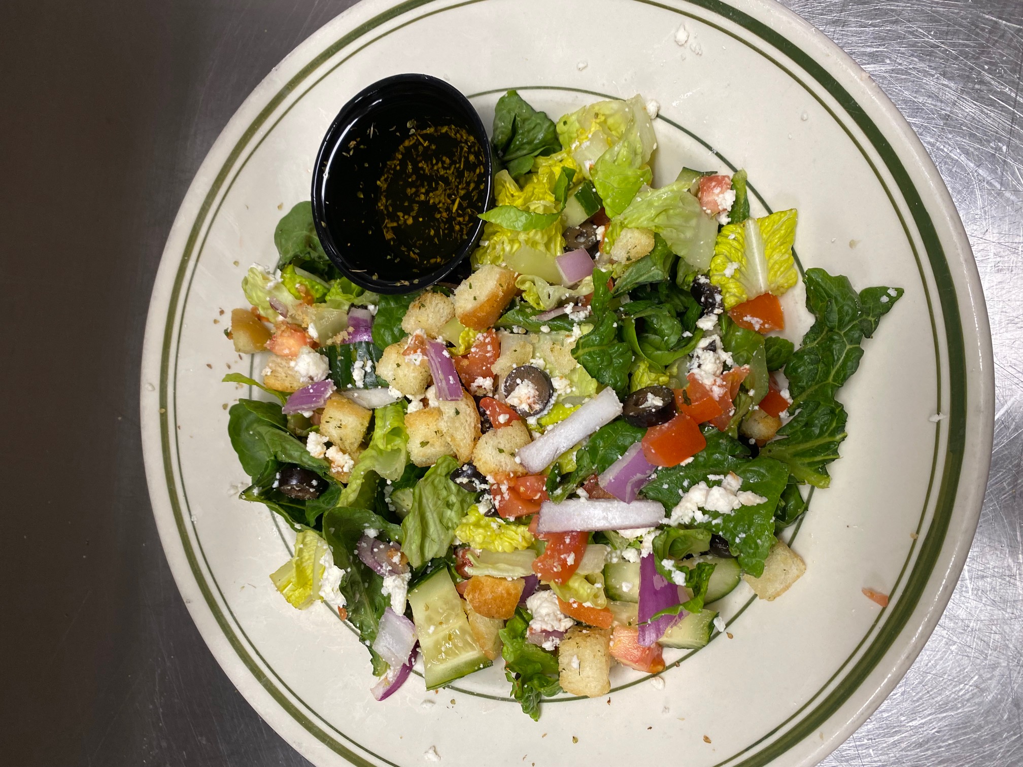 Order Greek Salad food online from Beggars Pizza store, Chicago on bringmethat.com