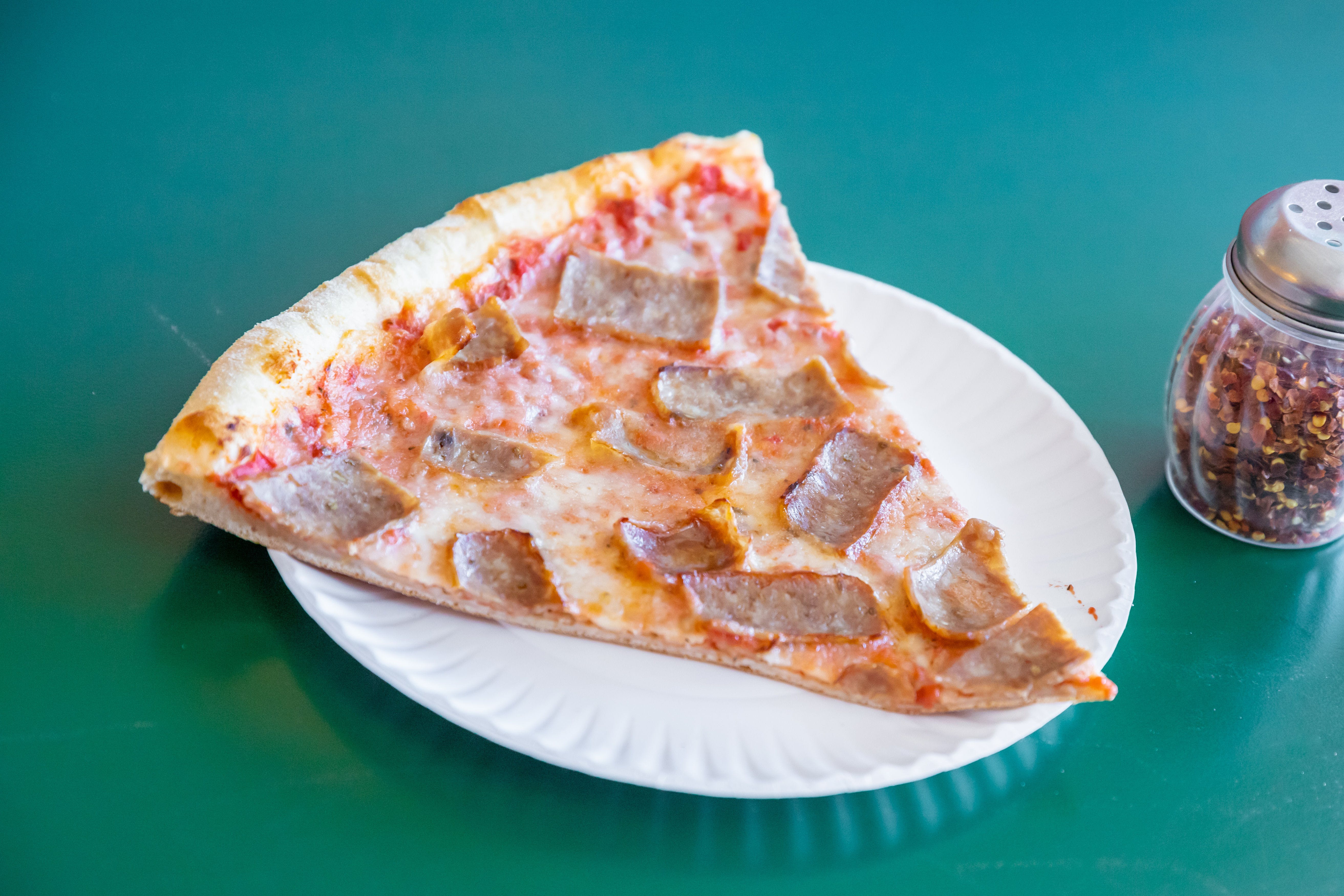 Order Sausage Pizza Slice - Slice food online from Uncle Sal's Italian Villa store, Budd Lake on bringmethat.com