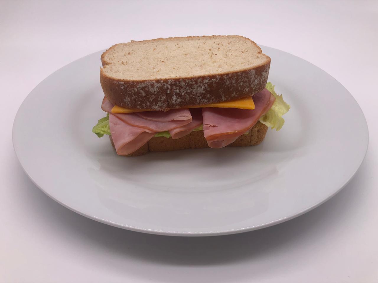 Order Ham and Cheddar Cheese Sandwich food online from Grind Coffee Shop store, San Diego on bringmethat.com