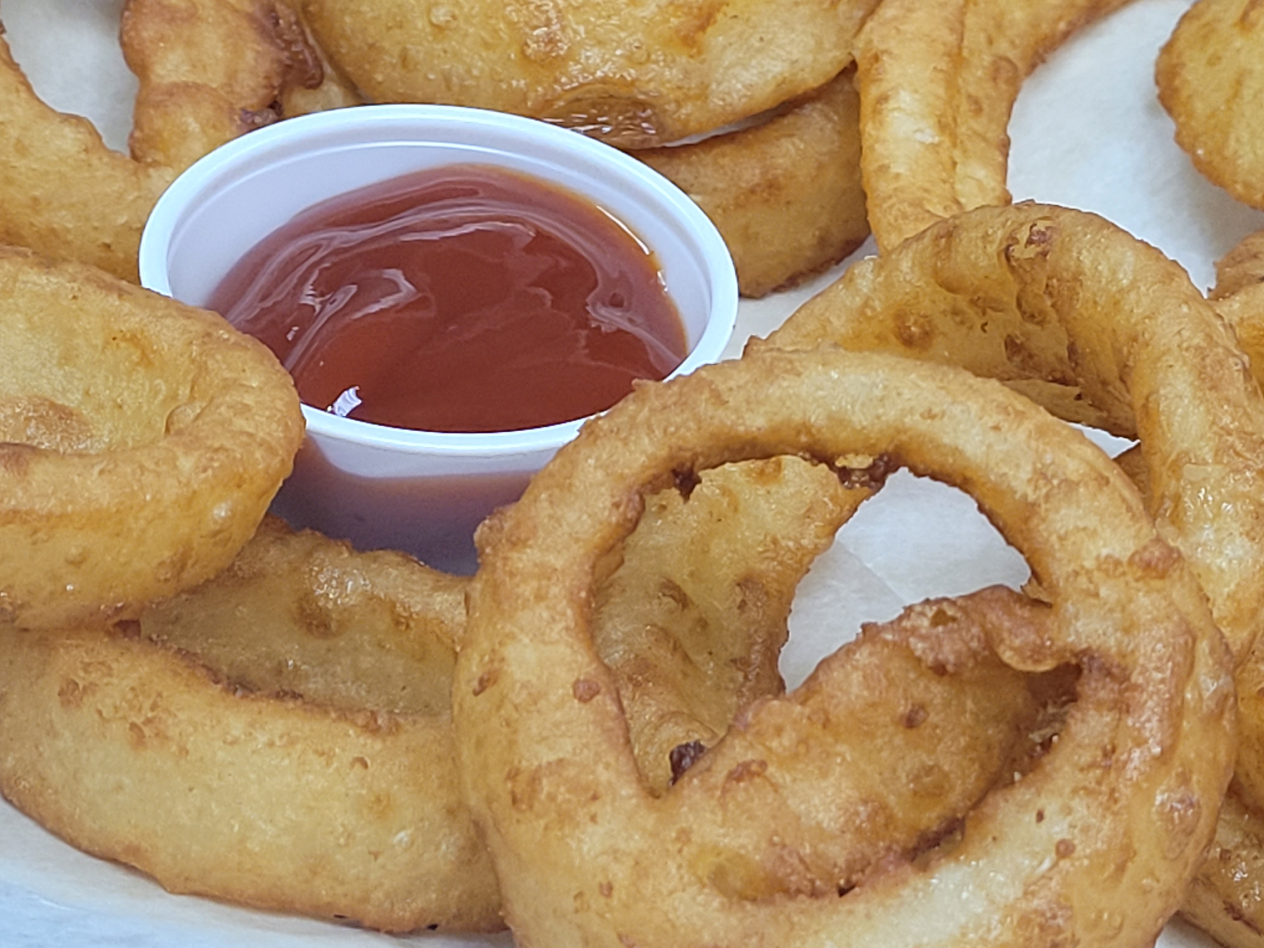 Order Onion Rings food online from Illianos Pizza store, Clemmons on bringmethat.com