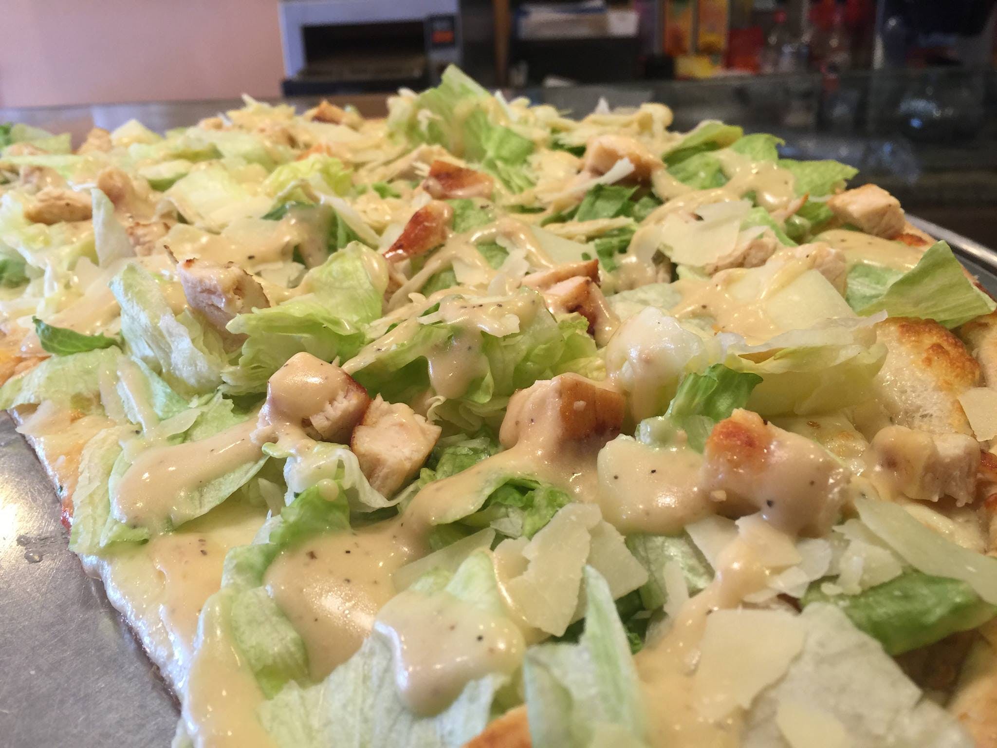 Order Caesar Salad Pizza - Medium 14'' (6 Slices) food online from Cafe Lark store, Albany on bringmethat.com