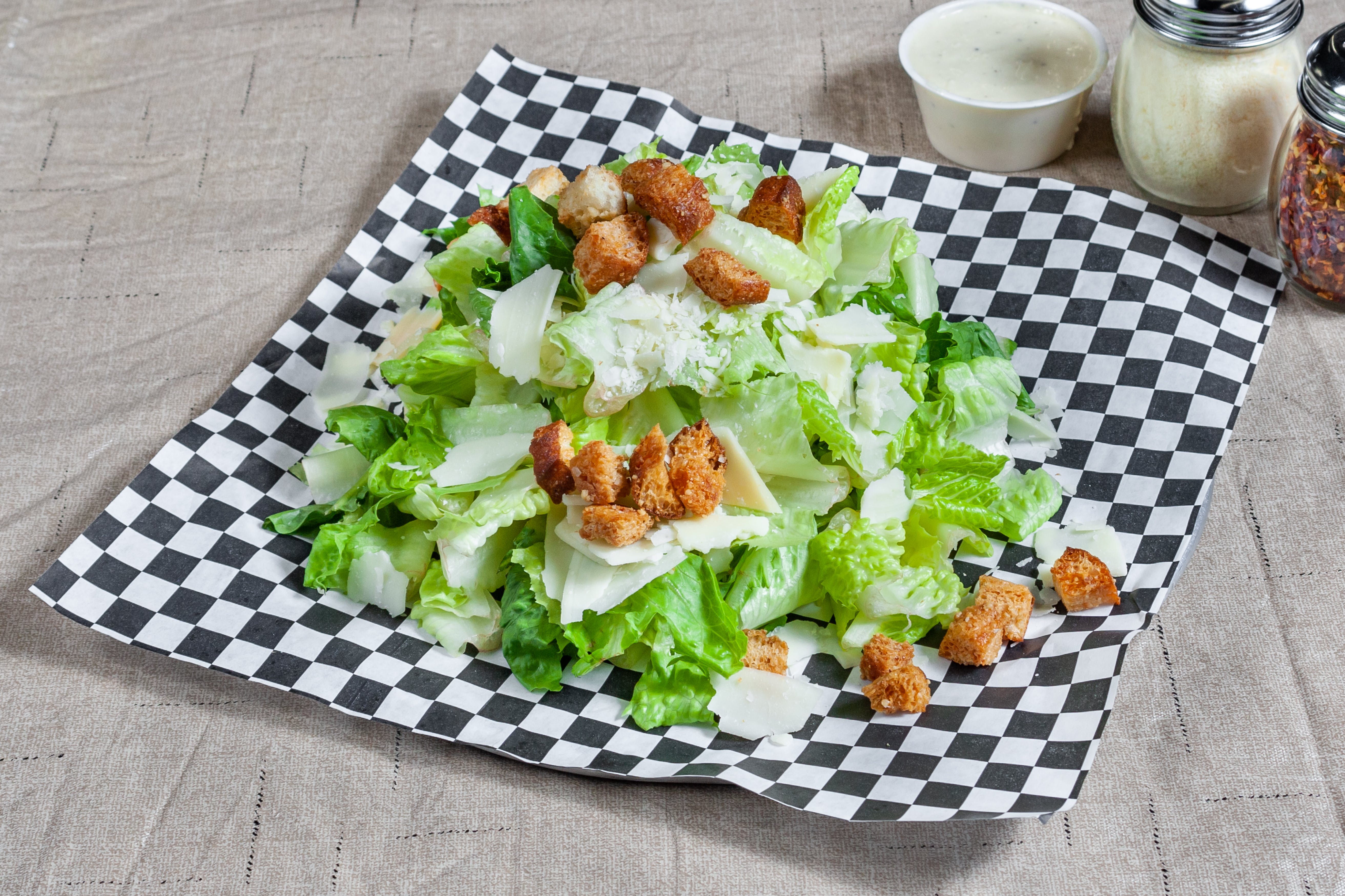 Order Caesar Salad - Salad food online from Geno D's Pizza store, Charlotte on bringmethat.com
