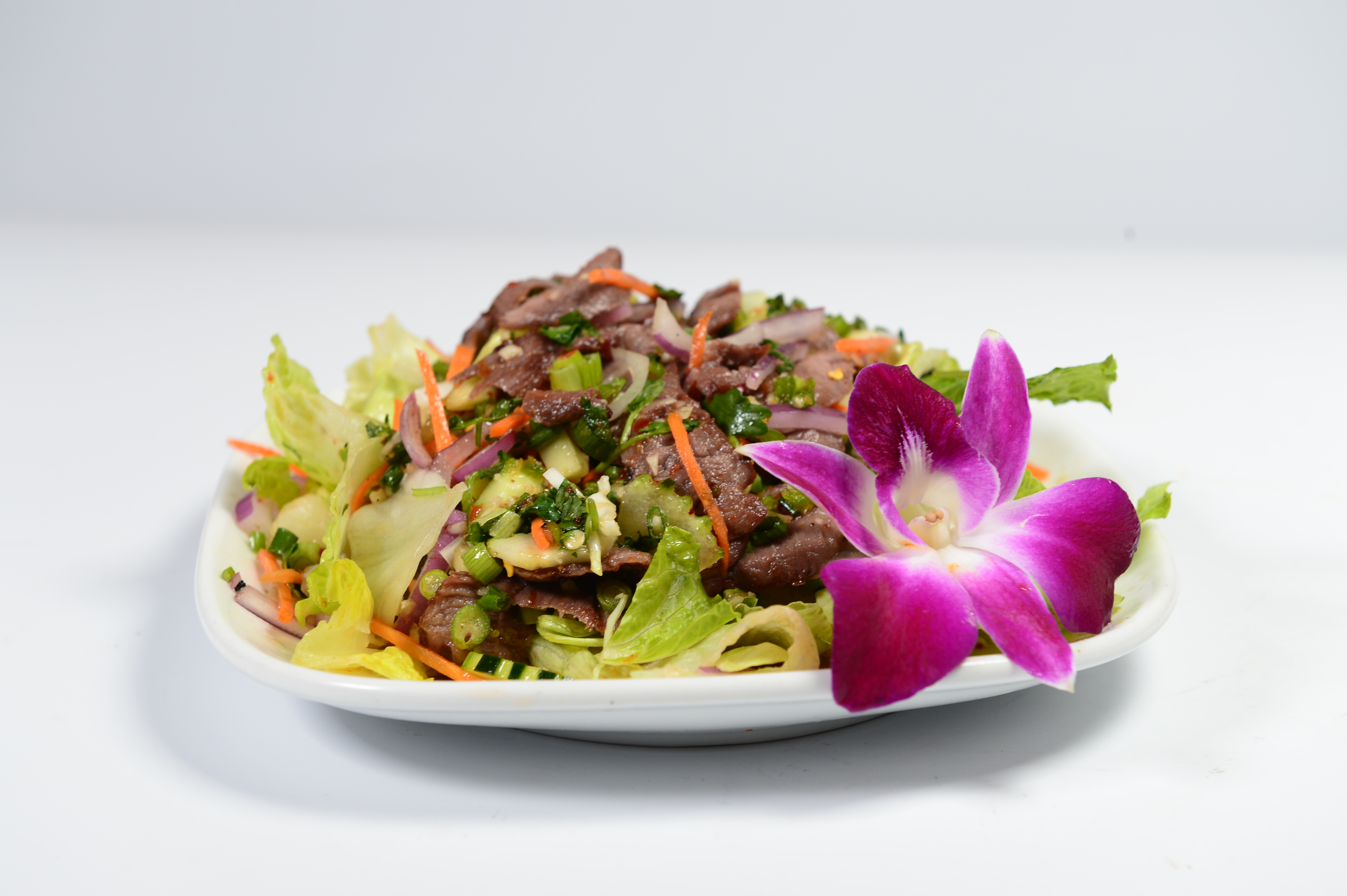 Order Hot Beef Salad food online from Lemongrass Thai Cuisine store, San Francisco on bringmethat.com