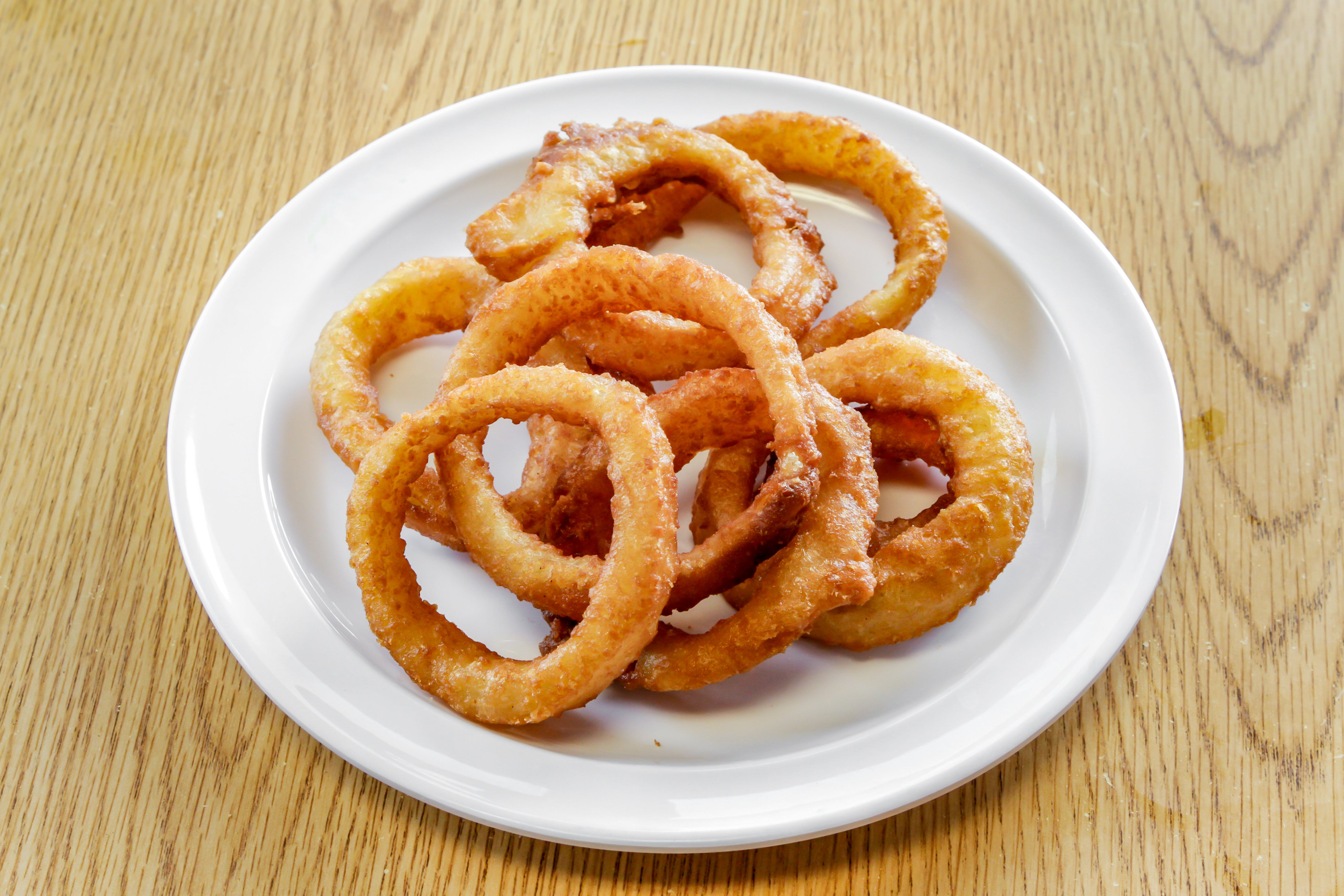 Order Onion Rings - Side food online from Marios Pizza store, Tucson on bringmethat.com
