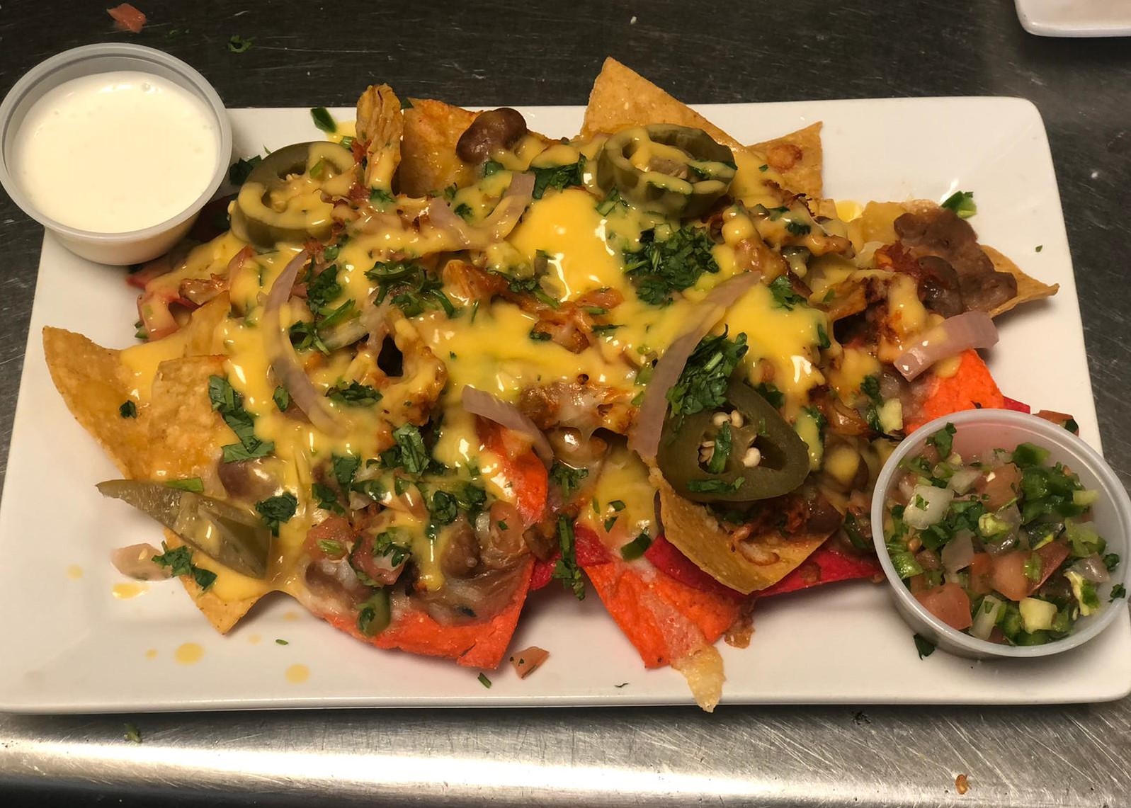 Order Nachos food online from Casa Tacos Mexican Restaurant store, New York on bringmethat.com