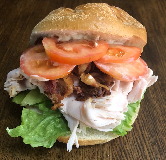 Order The Turkey Club Sandwich food online from Bread Brothers Bagel Cafe store, Brooklyn on bringmethat.com