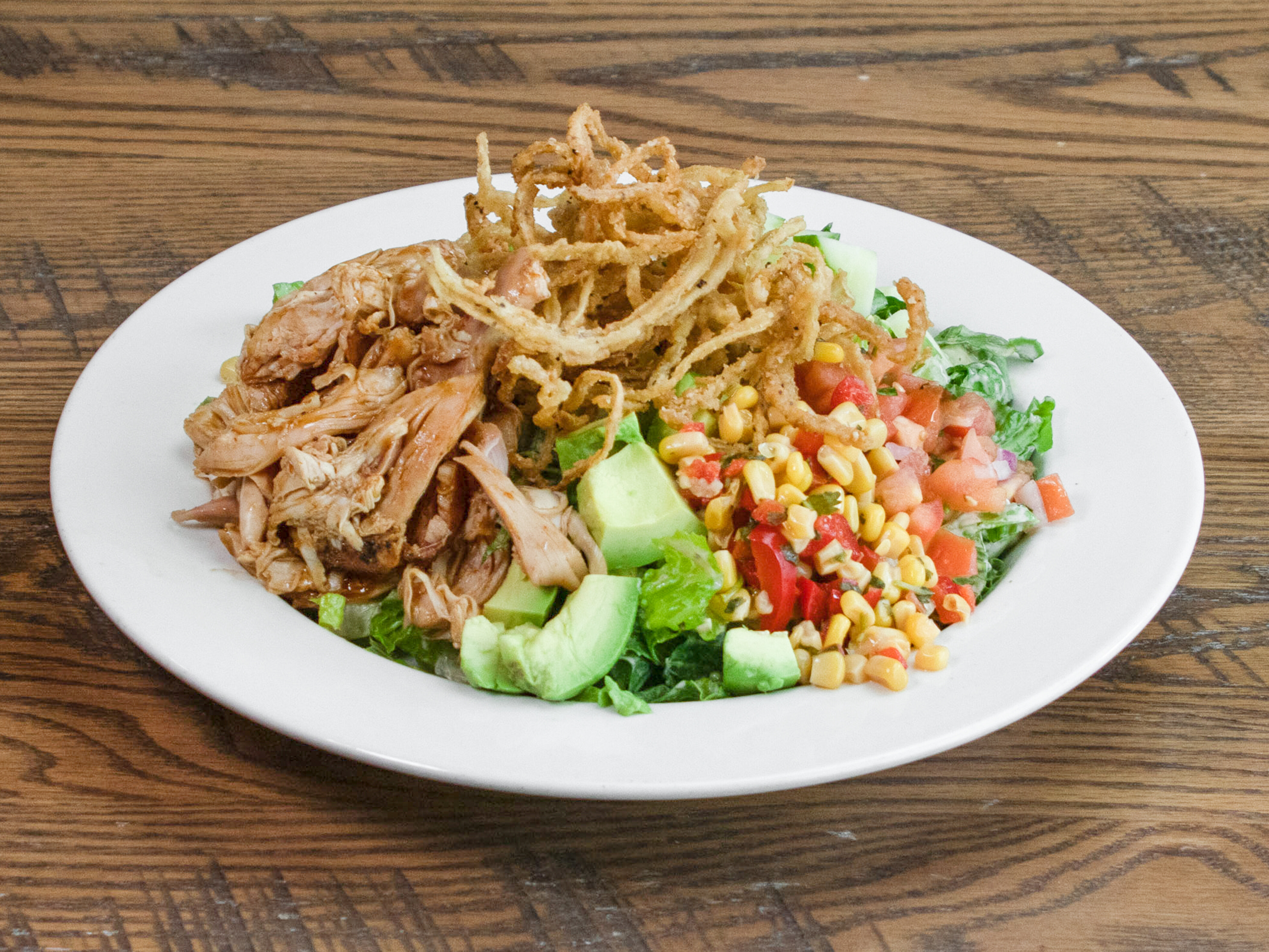 Order Cajun Chopped Salad food online from The Bone Bbq store, Old Town Manassas on bringmethat.com
