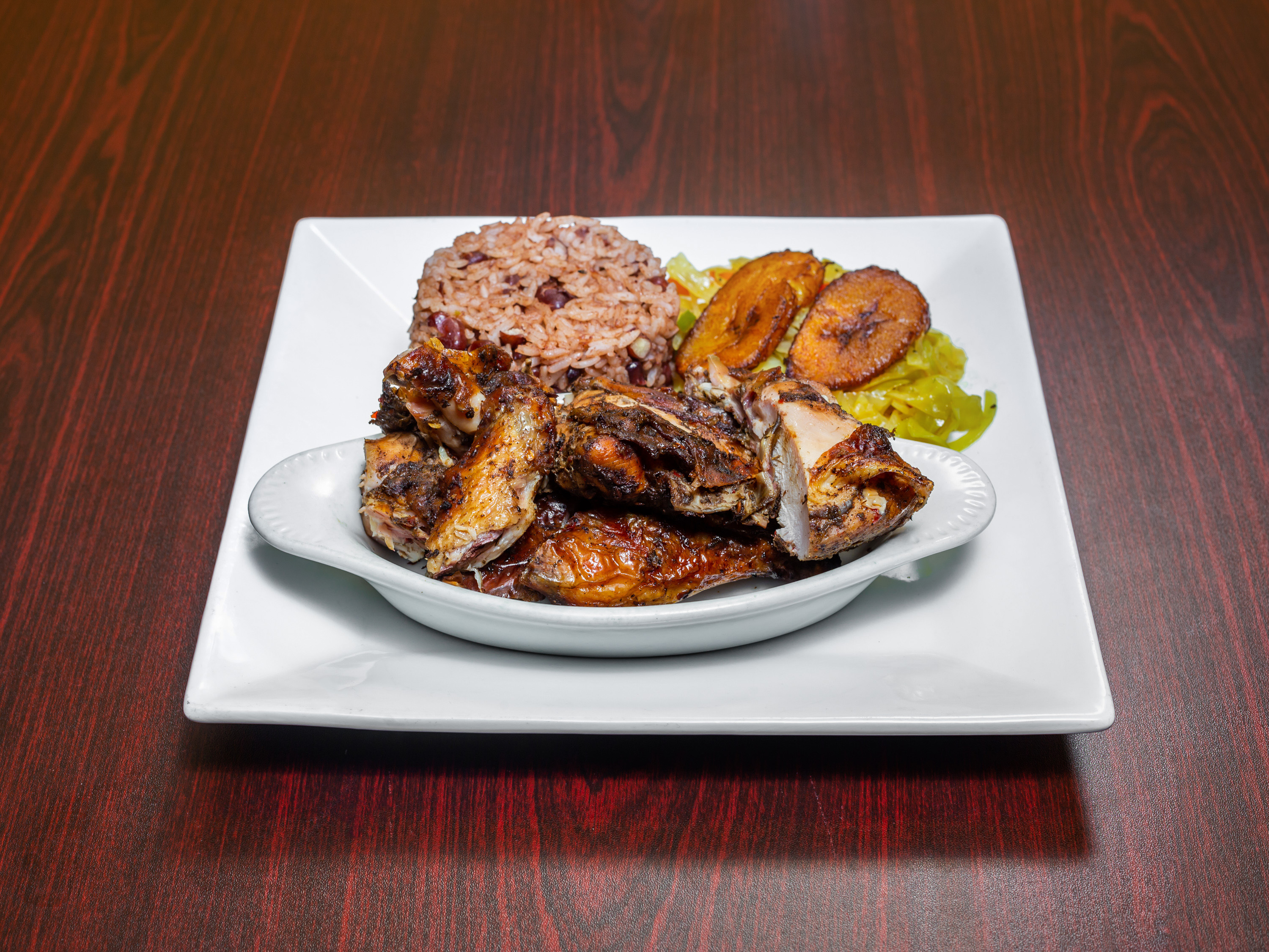 Order Succulent Jerk Chicken food online from Malakhi Lounge & Jamaican Restaurant store, Manassas on bringmethat.com
