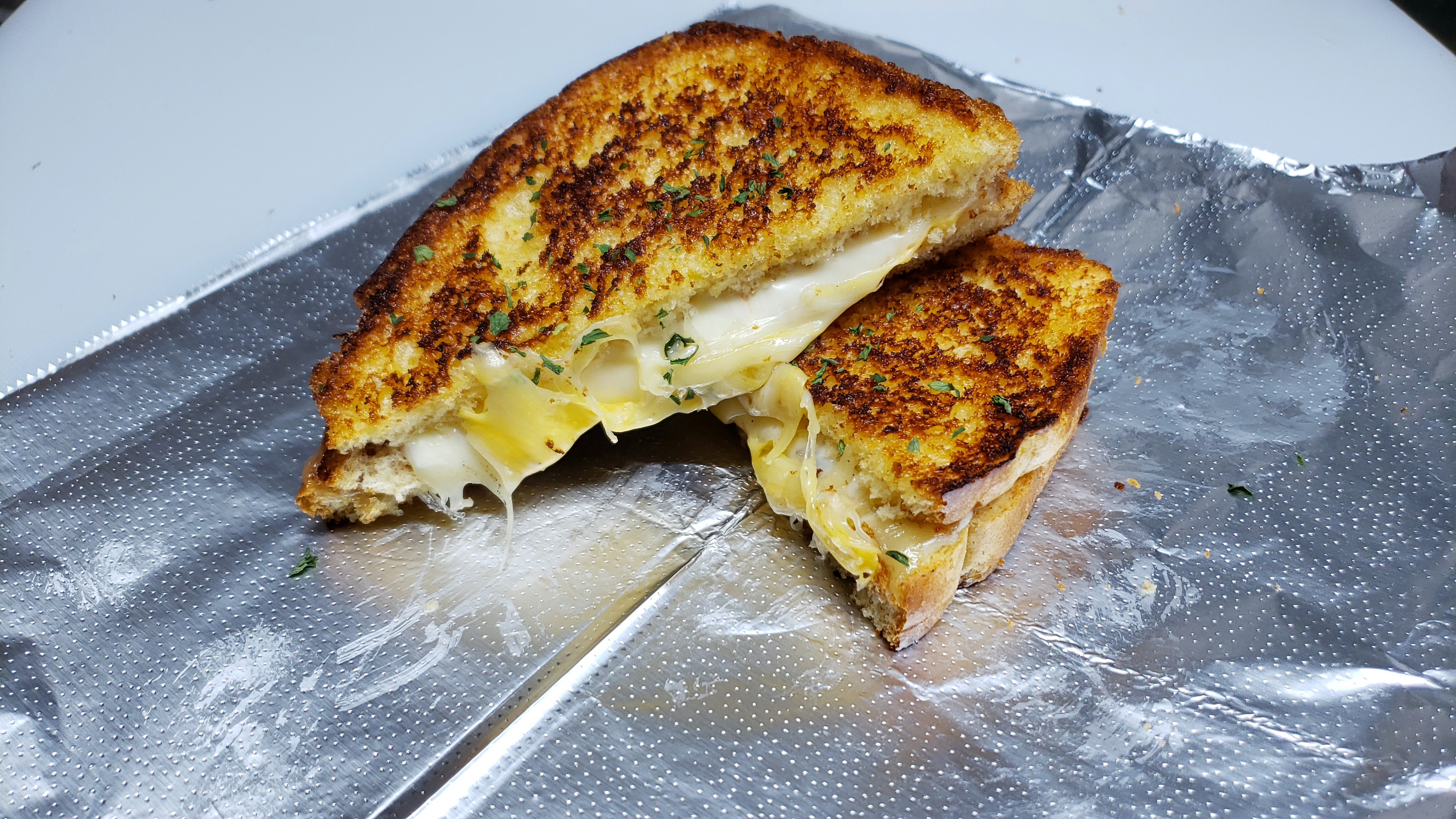 Order 4 of a Kind (4 Cheese Grilled Cheese) food online from Real Deal Grill store, Delaware on bringmethat.com