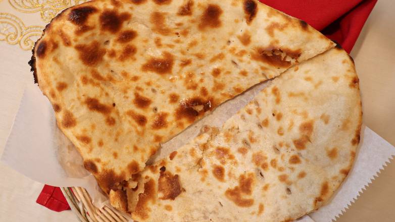 Order Naan Plain food online from New India Restaurant store, Columbus on bringmethat.com