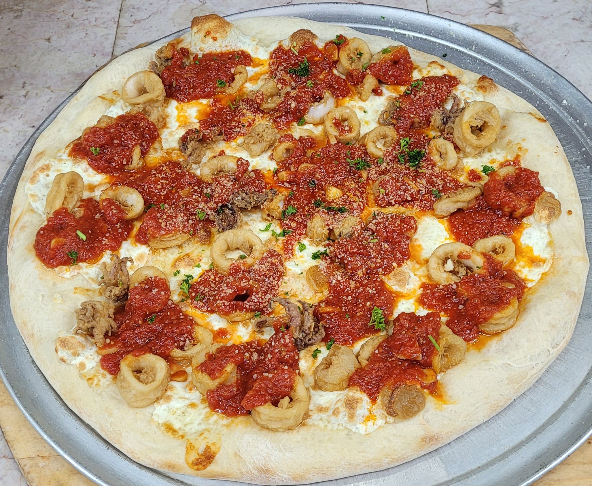 Order Fried Calamari Pizza - Small food online from Rhythm And Spice Pizzeria And Grill store, New Brunswick on bringmethat.com