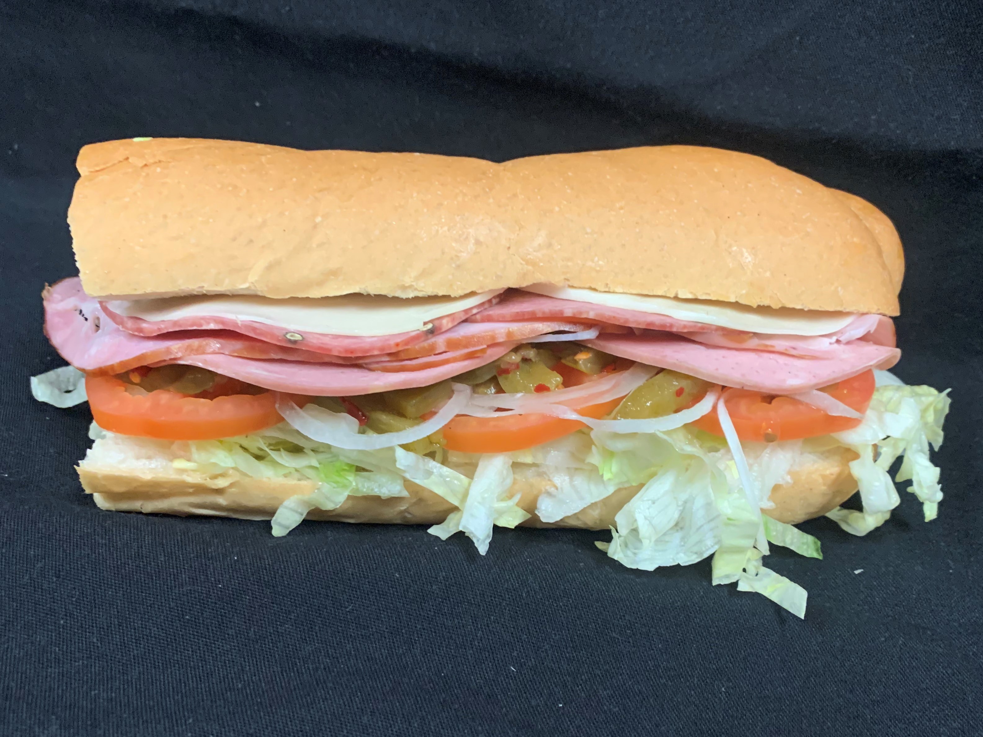 Order 1. Ham, Mortedella, Salami and Cheese Sub food online from Tony Subs & Pizza store, Inglewood on bringmethat.com
