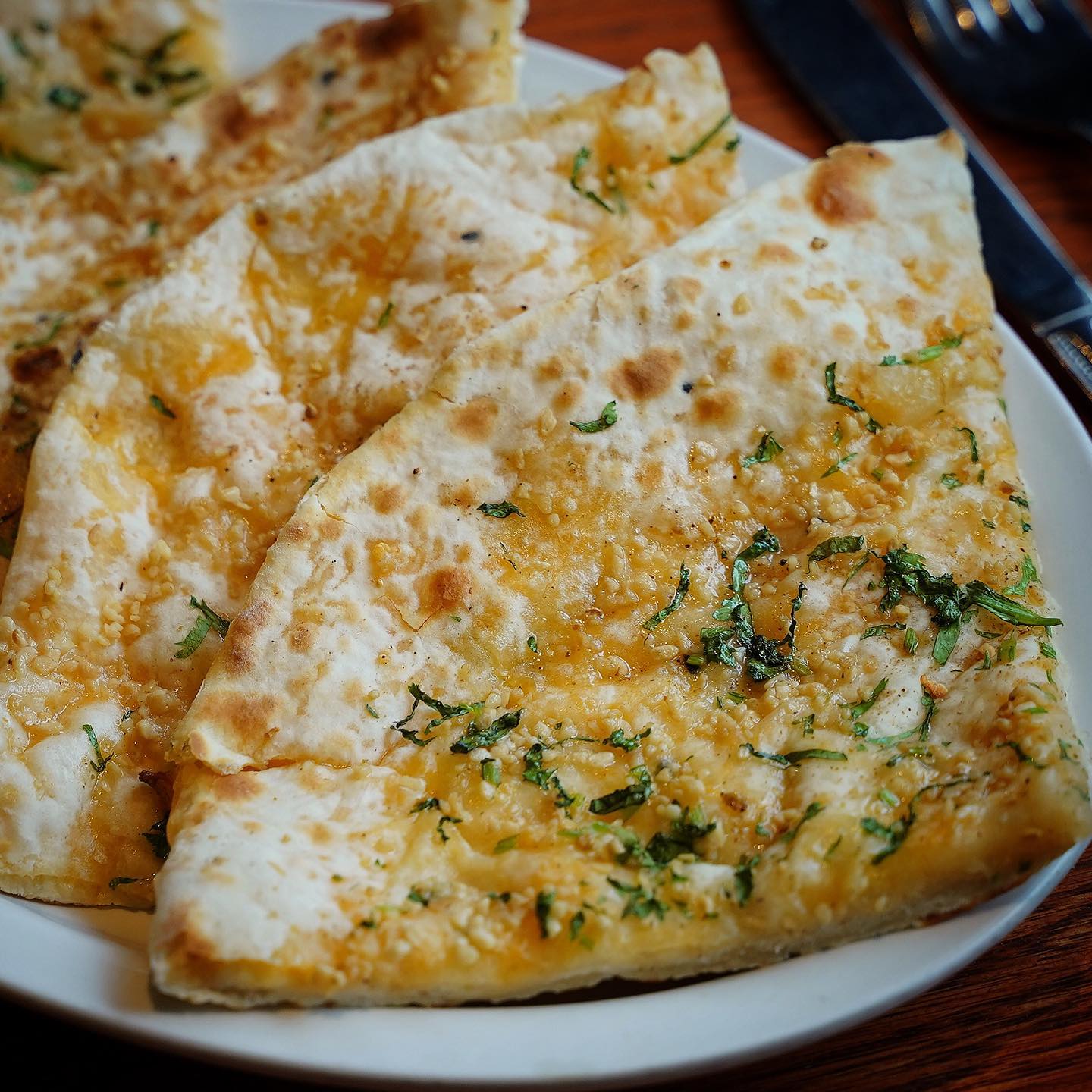 Order Garlic Cheese Naan food online from Little India store, Denver on bringmethat.com