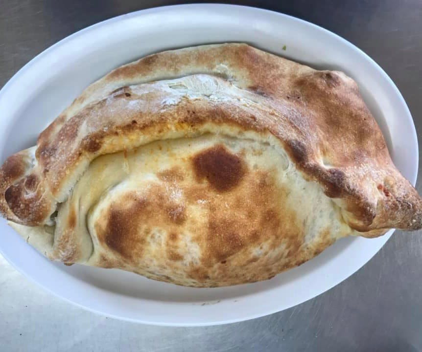 Order Cheese Calzone - Calzone food online from Italia Pizza store, El Cajon on bringmethat.com