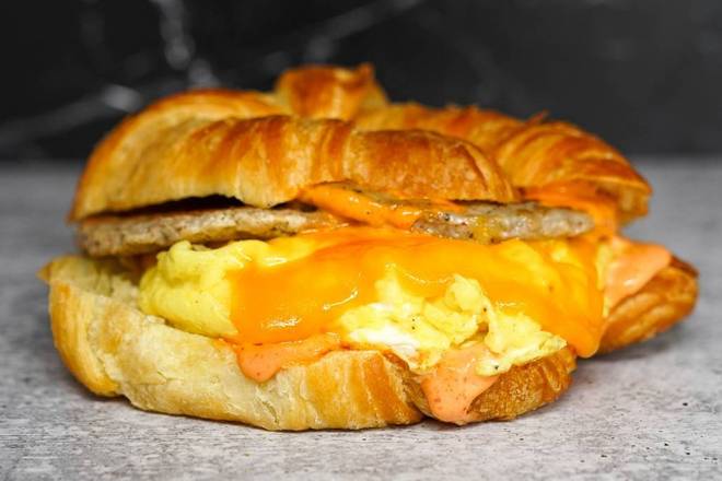 Order Impossible Sausage, Egg, & Cheddar Croissant Sandwich food online from Sunday Best Breakfast Sandwiches store, View Park-Windsor Hills on bringmethat.com