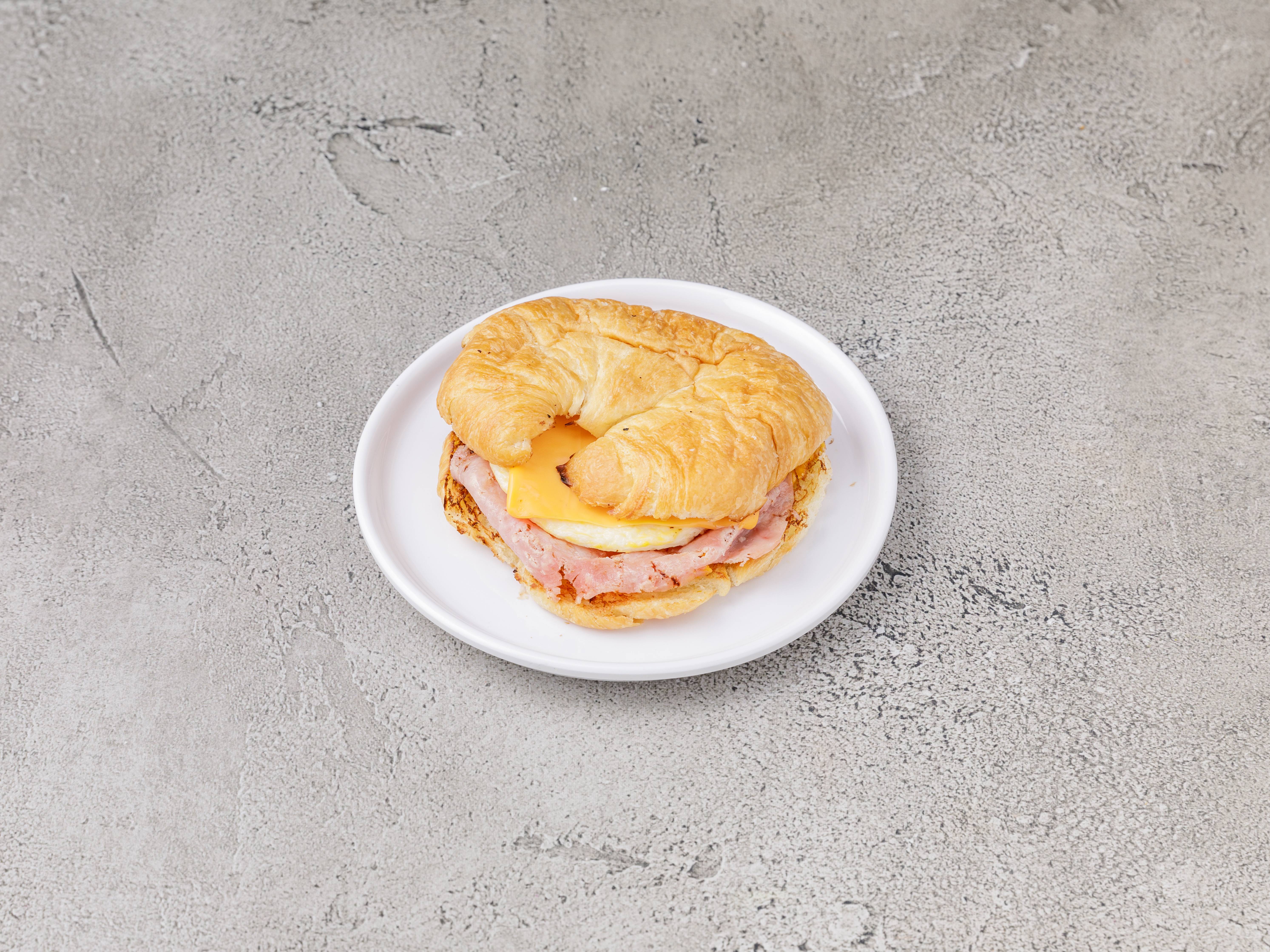 Order Meat, Egg and Cheese Croissant food online from Happy Donuts store, Atlanta on bringmethat.com