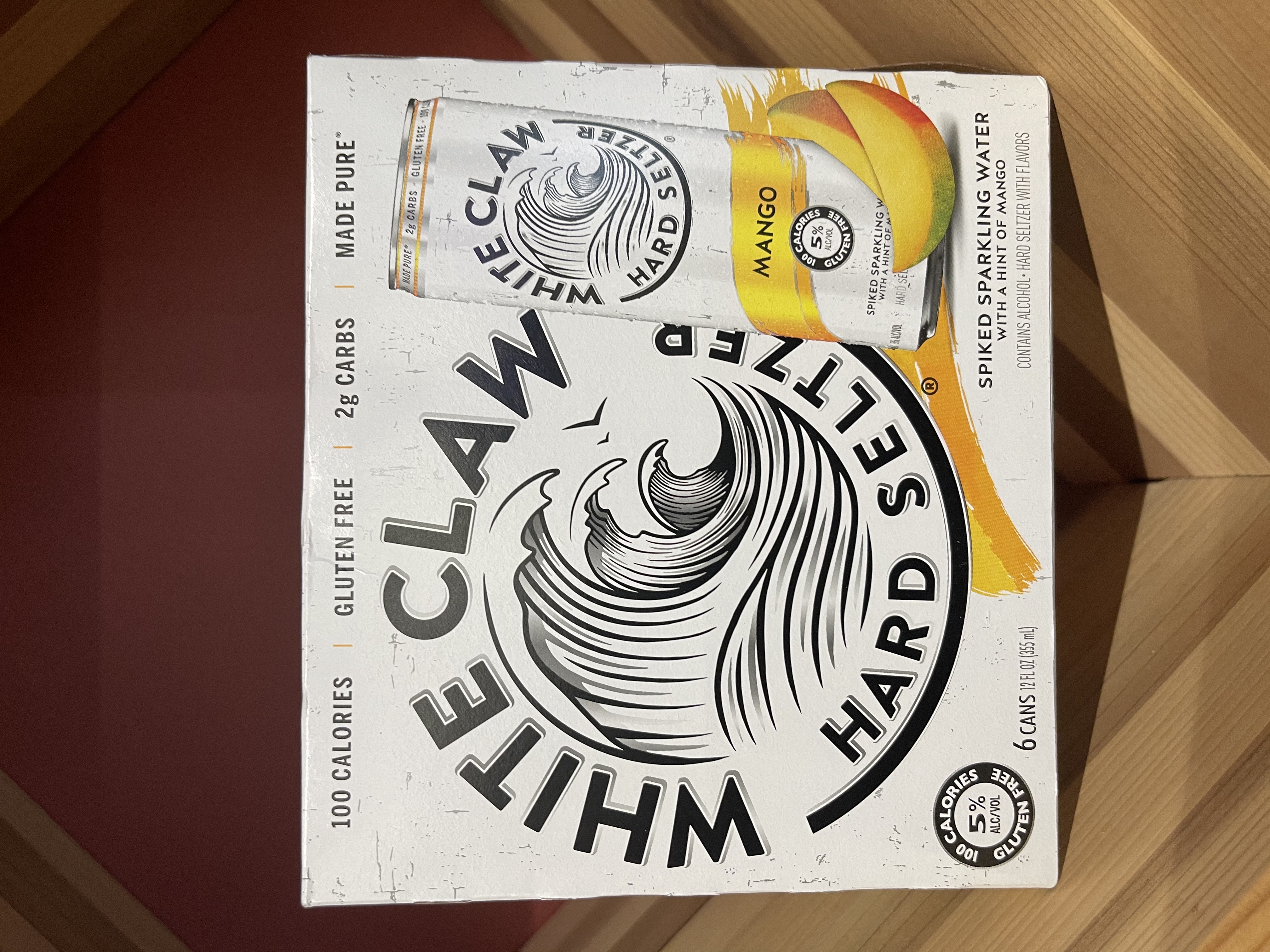 Order White Claw Mango 6 Pack-12 oz. Can Hard Seltzer food online from Esplanade Wine & Spirits store, Arlington Heights on bringmethat.com