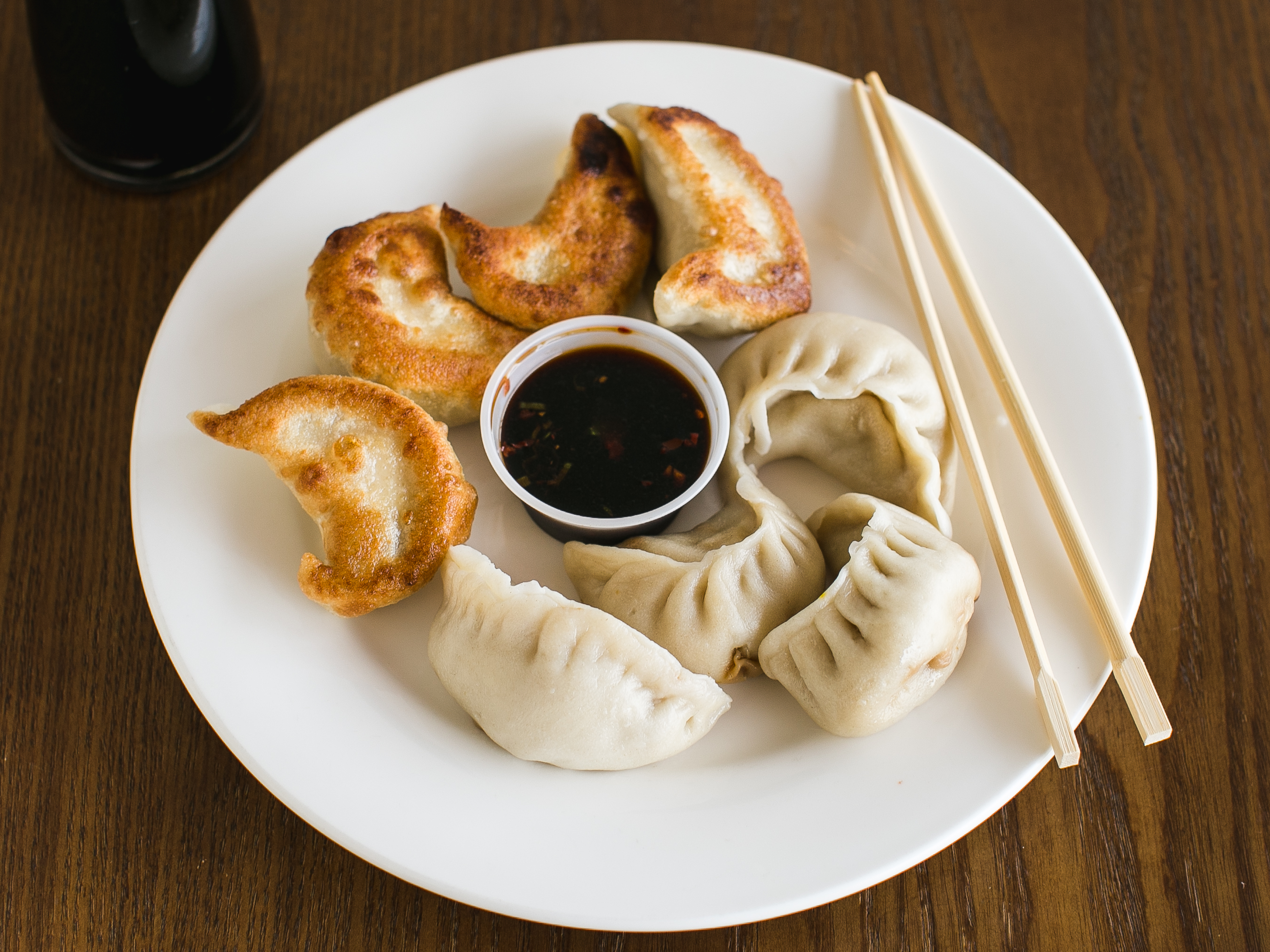 Order 12. Pork Dumplings food online from Mayflower Chinese Restaurant store, Marlton on bringmethat.com