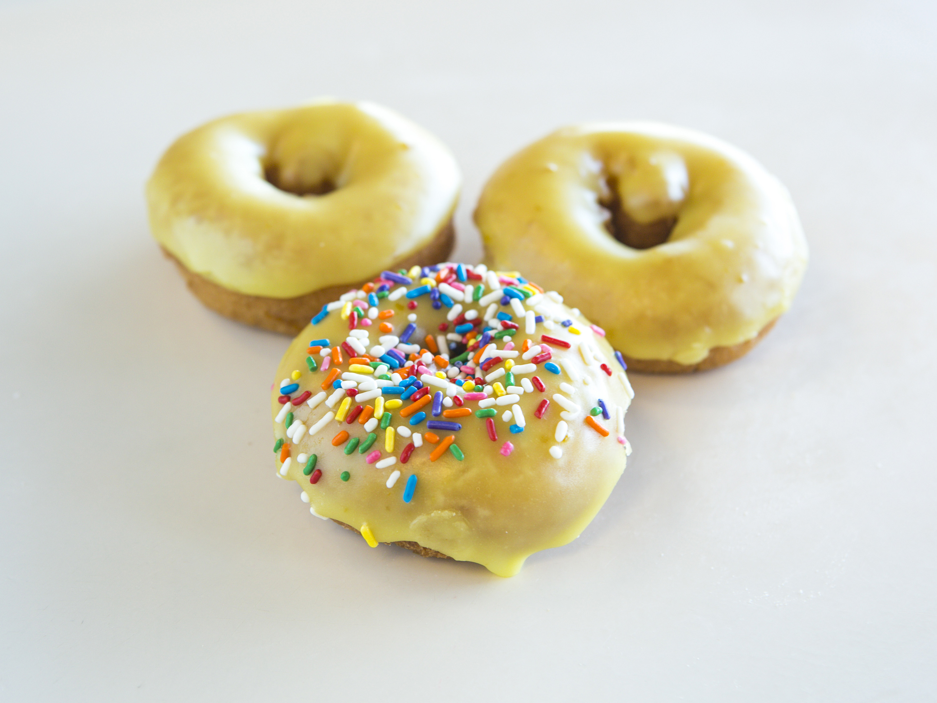 Order Lemon Iced Cake Donut food online from Ray's Donuts store, Kansas City on bringmethat.com