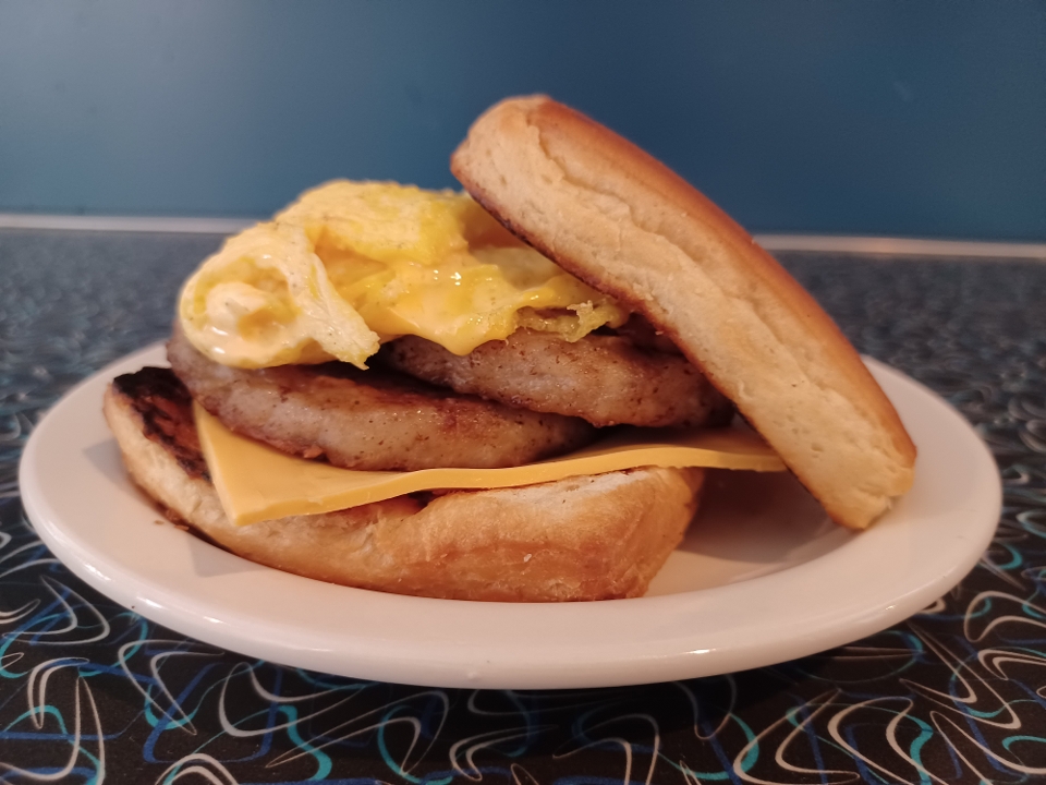 Order Sausage Breakfast Sandwich food online from Muffin Top Cafe store, Minneapolis on bringmethat.com