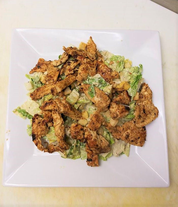 Order Grilled Chicken Caesar Salad - Salad food online from Nicola's Pizza store, Califon on bringmethat.com