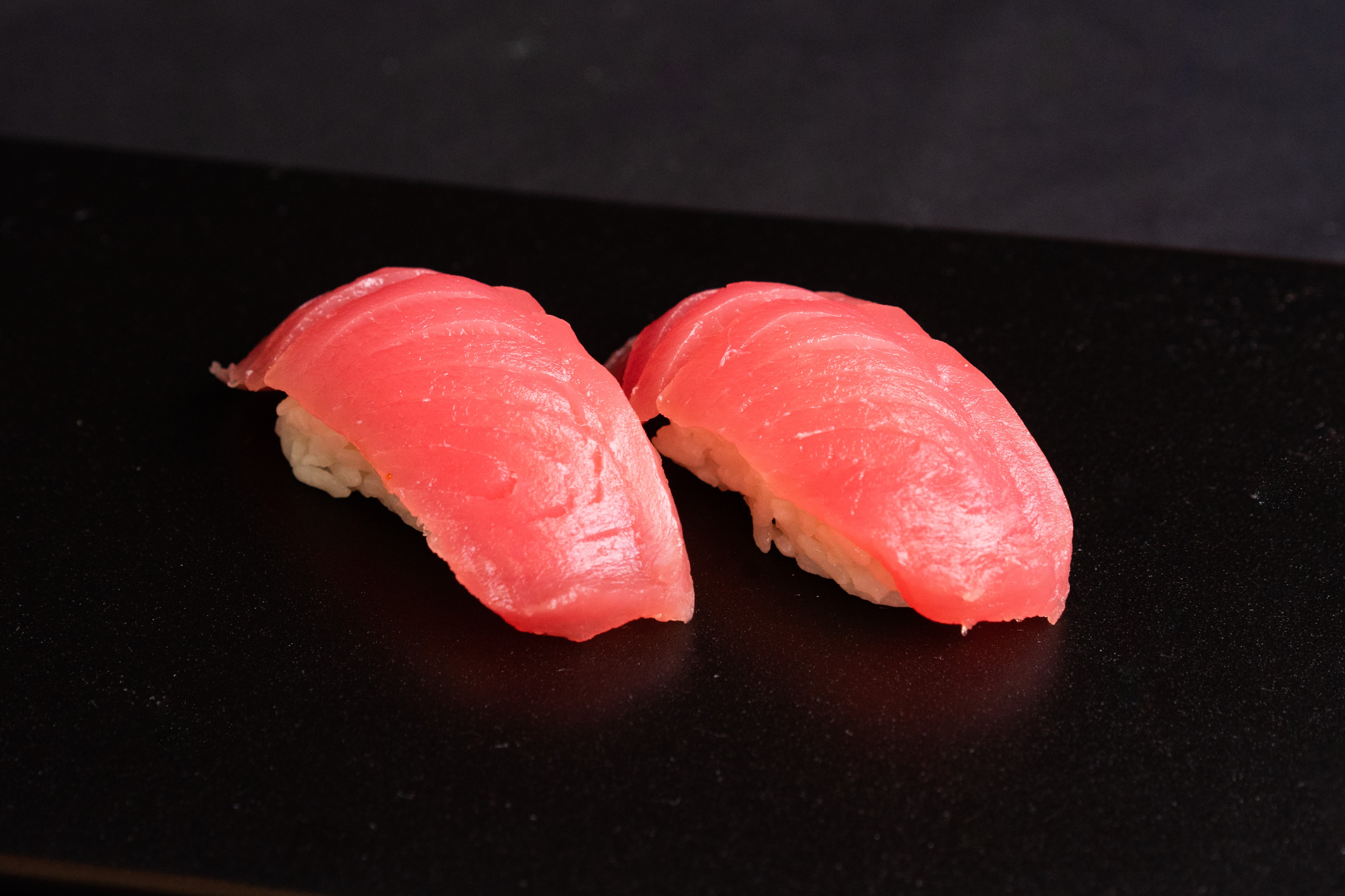 Order Tuna Nigiri food online from O Maki Rolls + Teriyaki store, Seattle on bringmethat.com