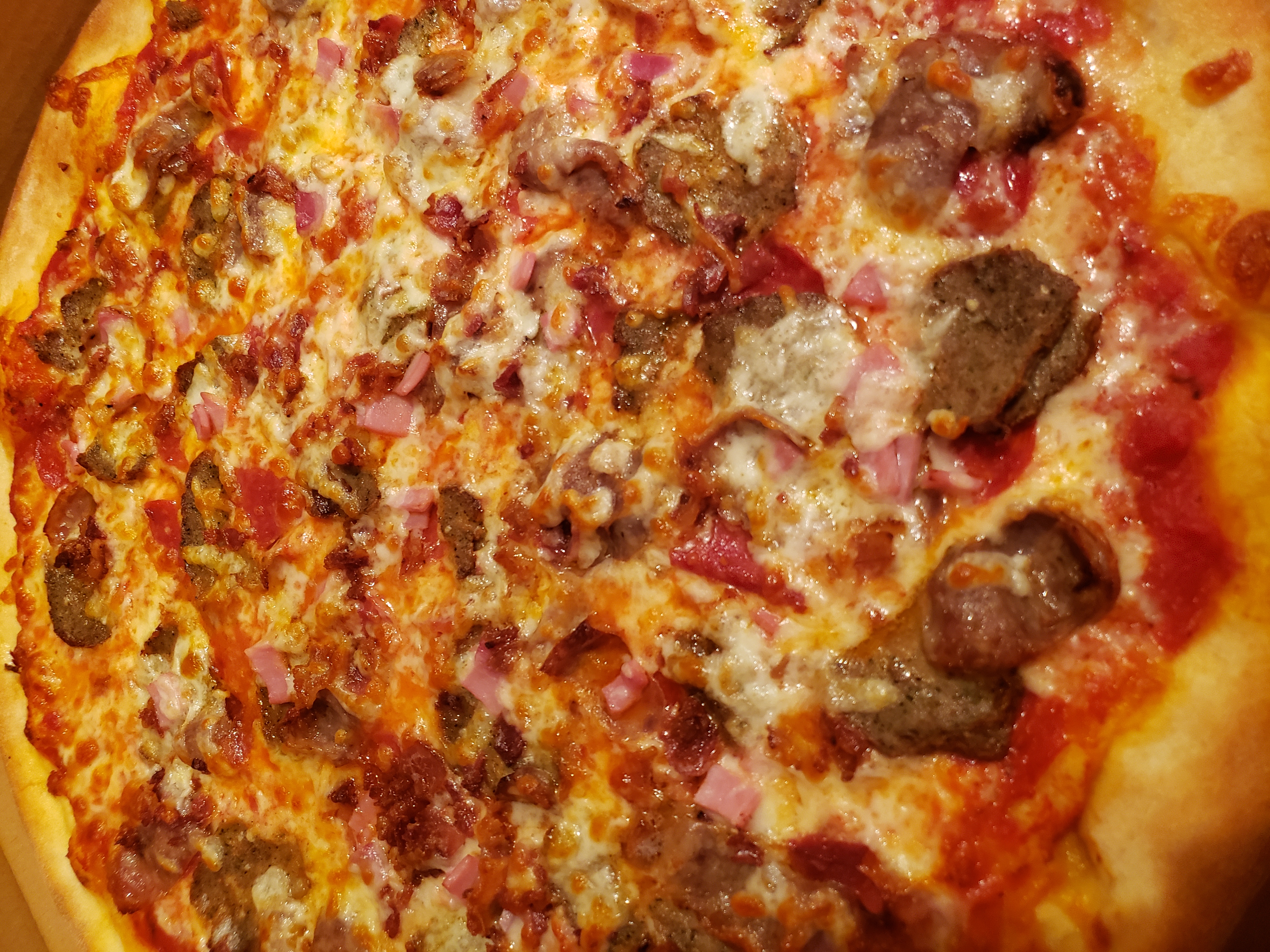 Order Carnivore Pizza food online from Big Joe Pizzeria store, East Meadow on bringmethat.com