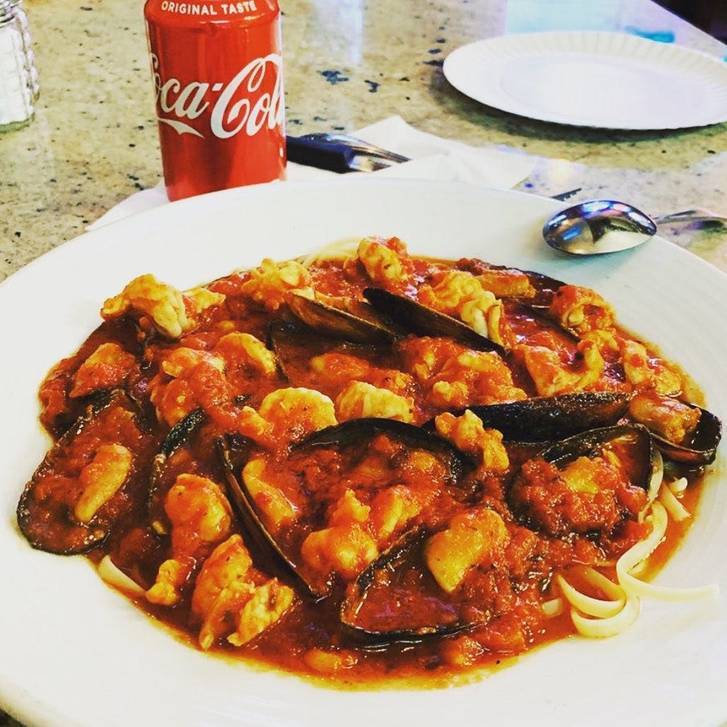Order Linguine with Mussels Marinara - Seafood food online from Dominic's Pizza store, Lakewood on bringmethat.com