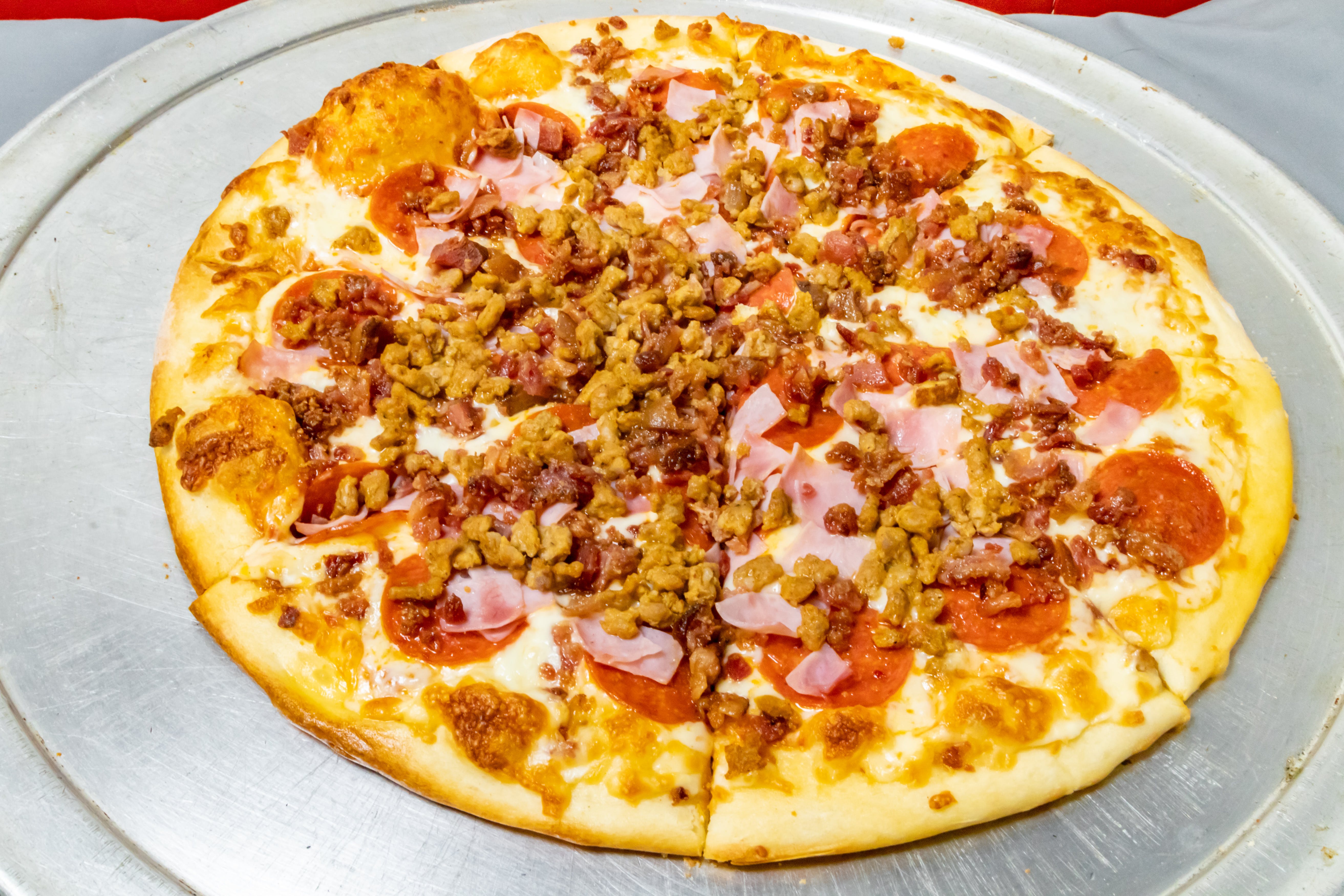 Order 4 Meat Pizza - Small 10" (4 Cut) food online from Novotny's Groceries & Pizza store, Worthington on bringmethat.com