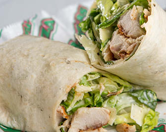 Order Chicken Caesar Wrap food online from Beggar Pizza store, Merrionette Park on bringmethat.com