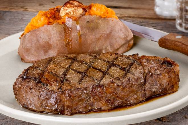 Order 16 oz. Signature Ribeye food online from Logans Roadhouse store, Southgate on bringmethat.com