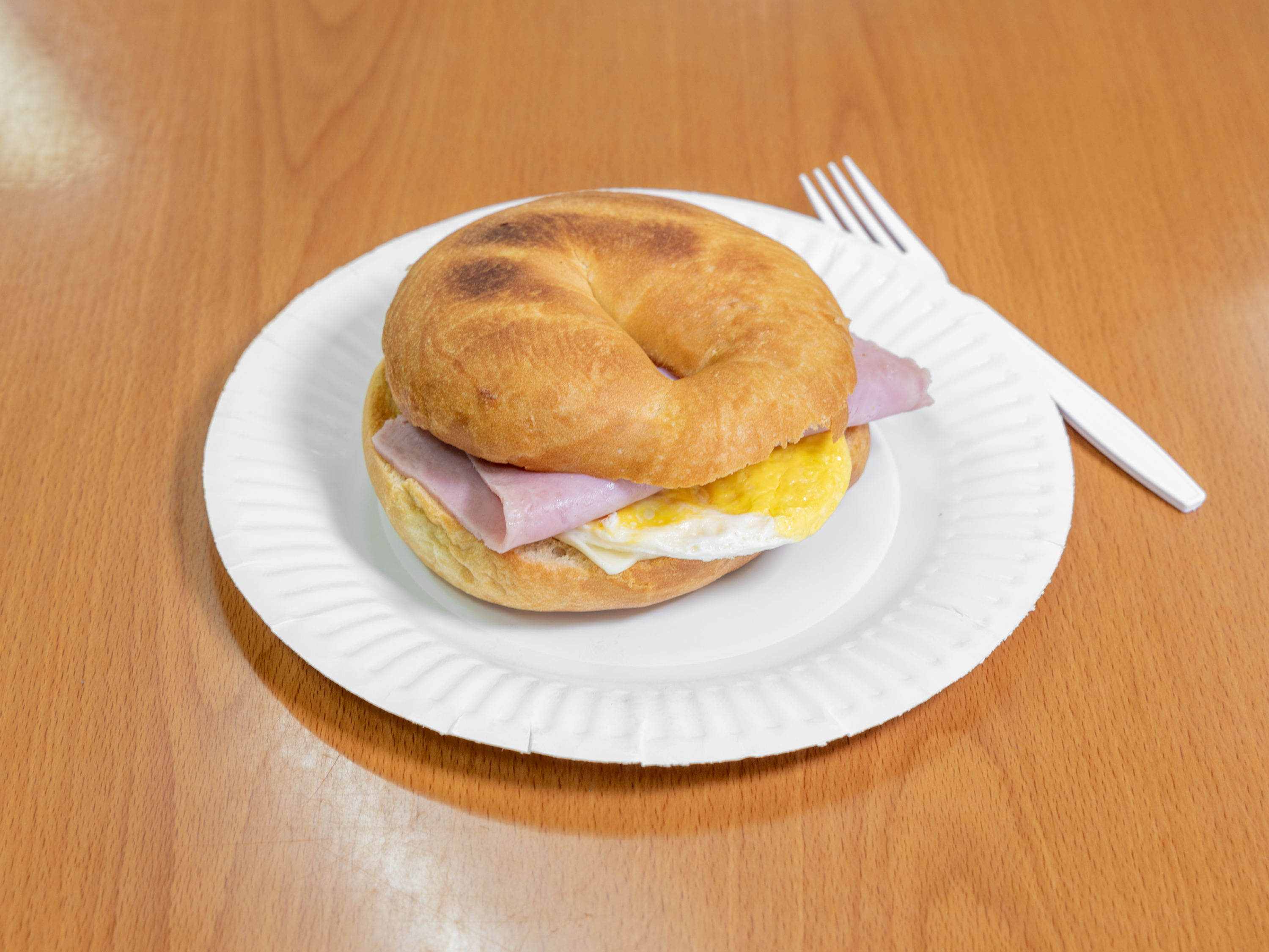 Order 3. Ham, Bacon, Egg & Cheese on Bagel food online from Love Donuts Cafe store, Riverside on bringmethat.com