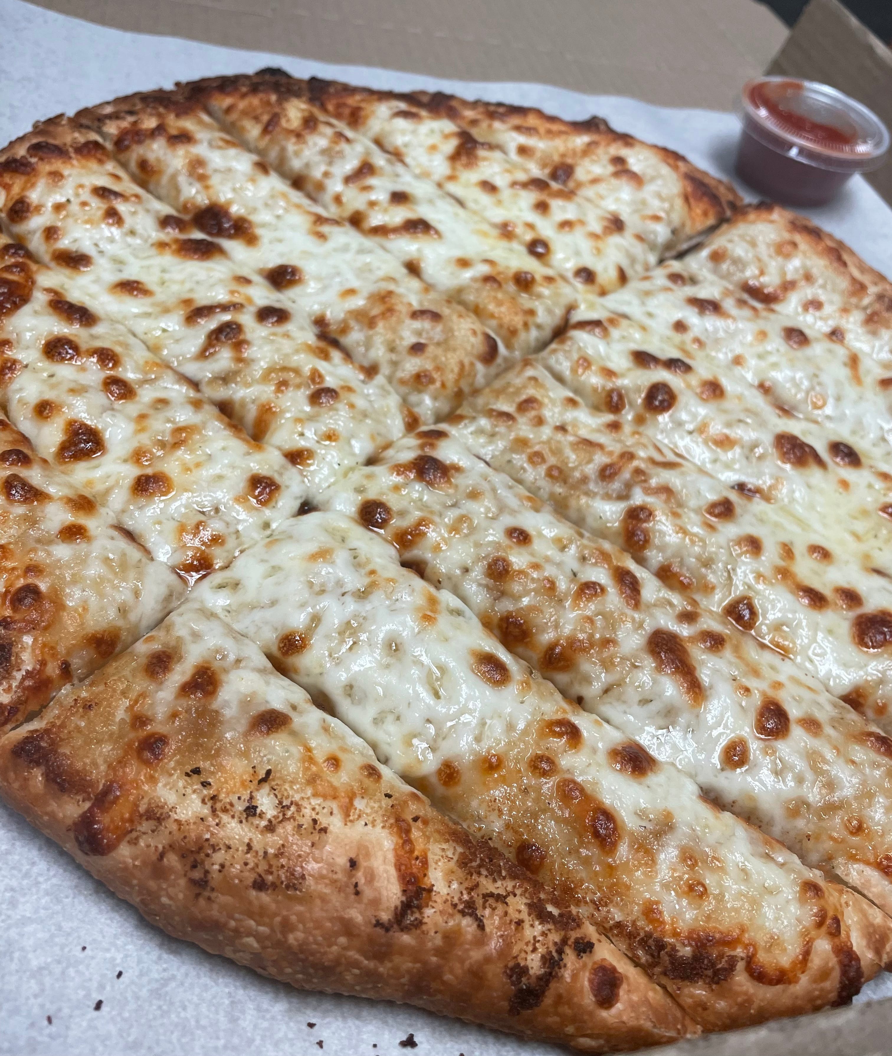Order Garlic Cheesy Bread - Large food online from Oscar's Pizza store, Lakewood on bringmethat.com