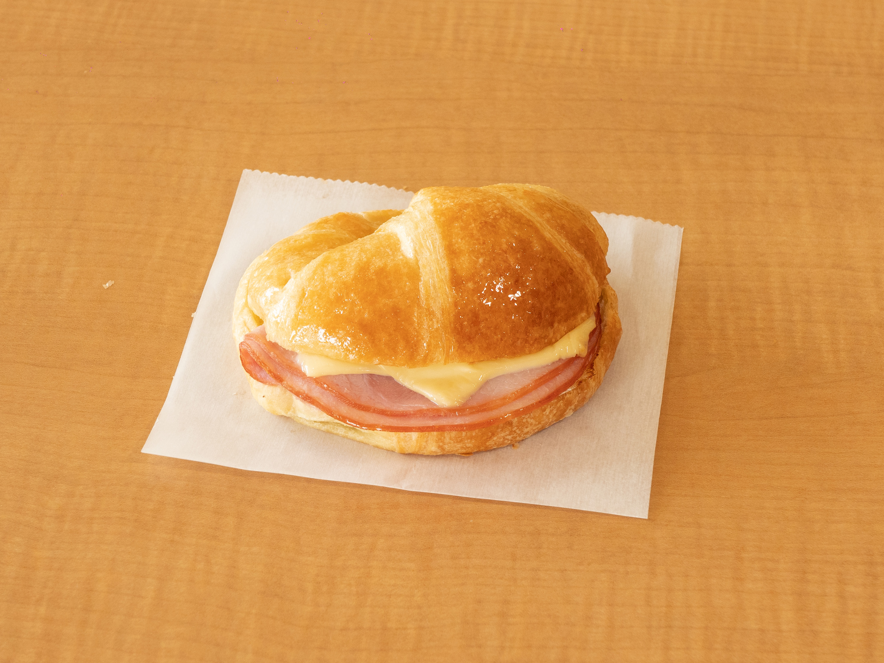 Order Ham and Cheese Croissant Sandwich food online from Sara Donuts store, Euless on bringmethat.com