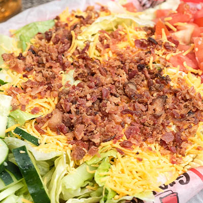 Order *Bacon & Cheddar Salad food online from Groucho's Deli store, Spartanburg on bringmethat.com
