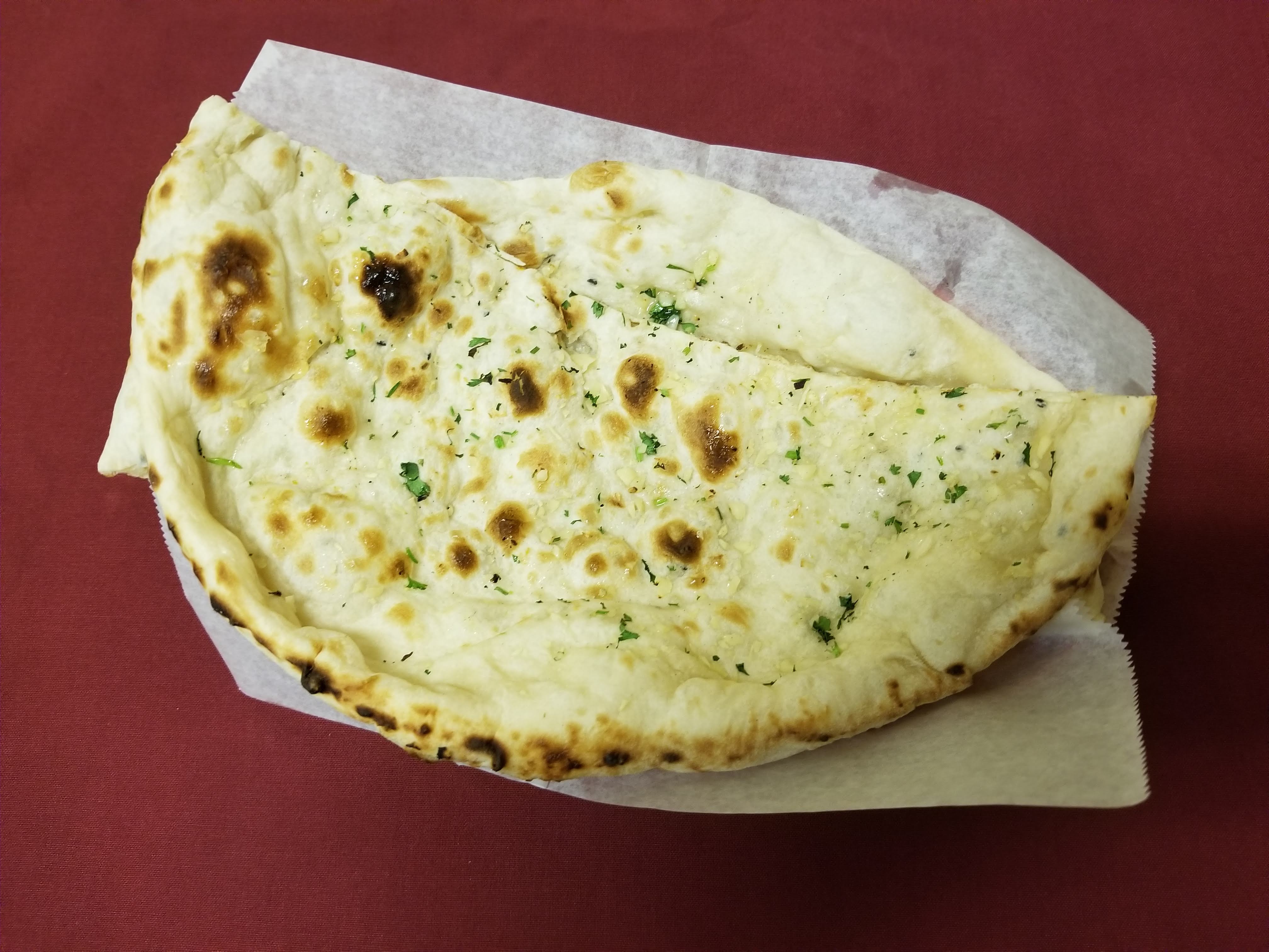 Order Garlic Naan food online from Star of India store, Ferndale on bringmethat.com