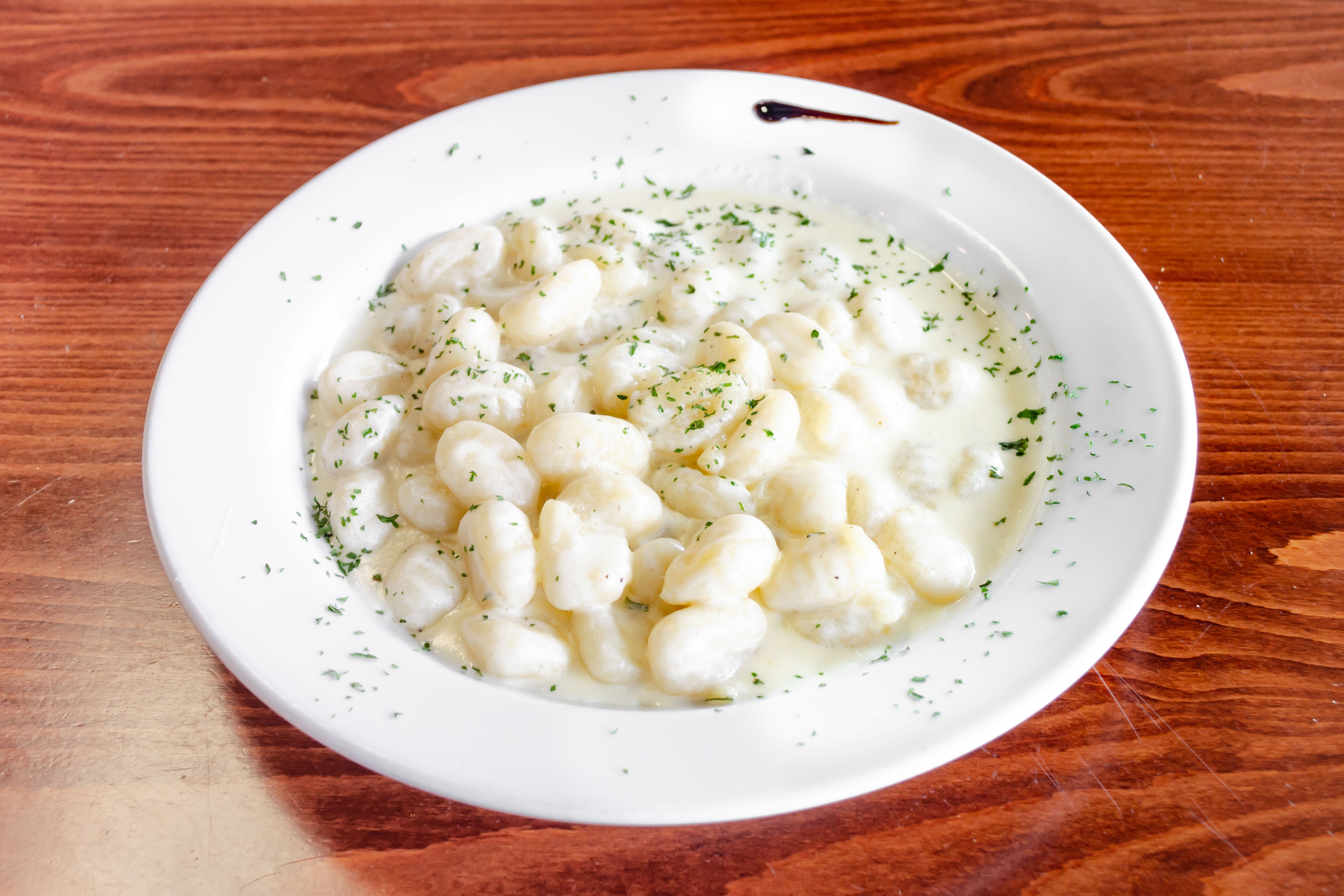 Order Gnocchi with 4 Cheeses - Pasta food online from Nonna Rosa Pizzeria store, Carlstadt on bringmethat.com
