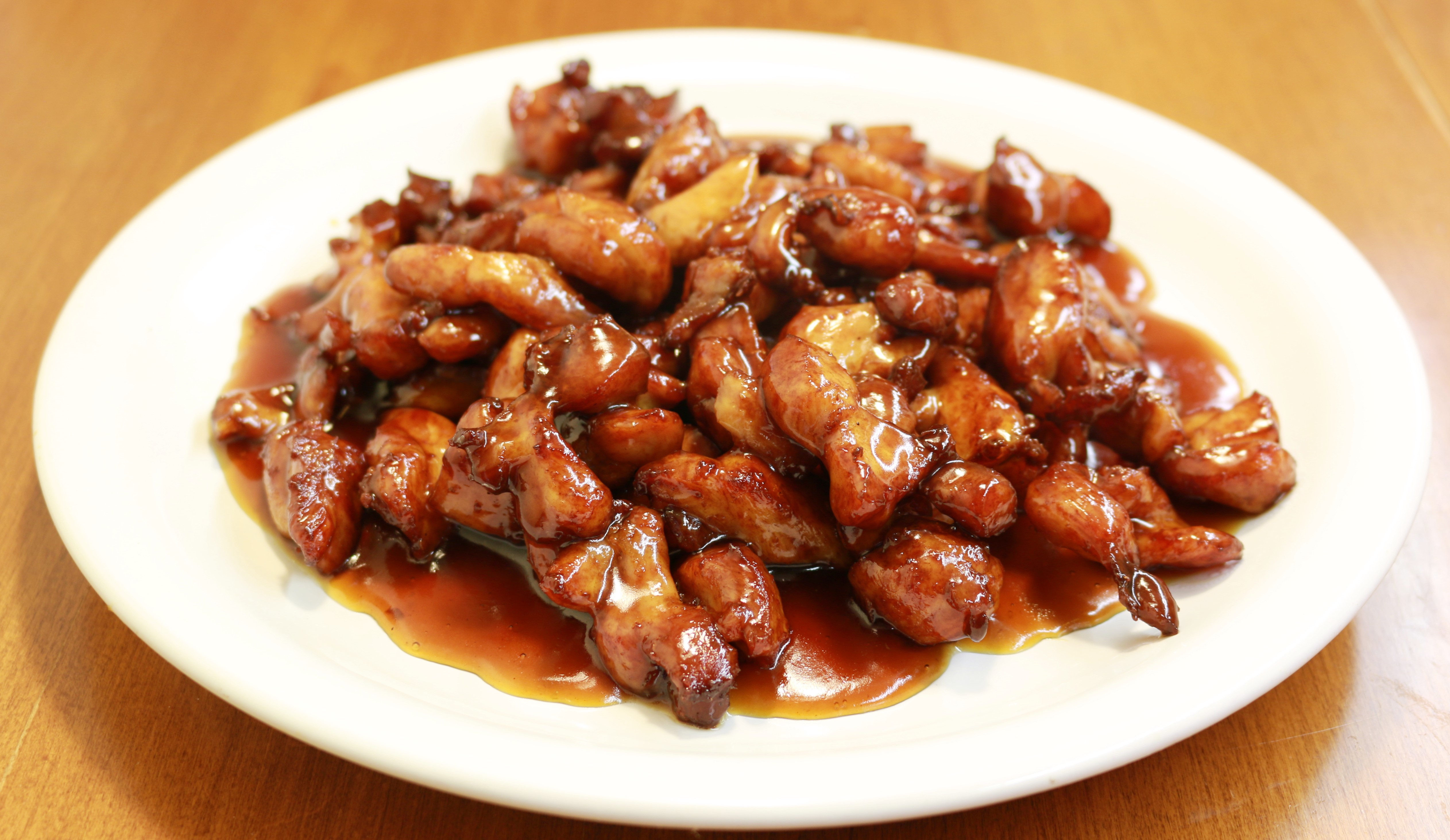 Order Large Bourbon Chicken food online from Lucky Wok Chinese Kitchen store, Garden City on bringmethat.com