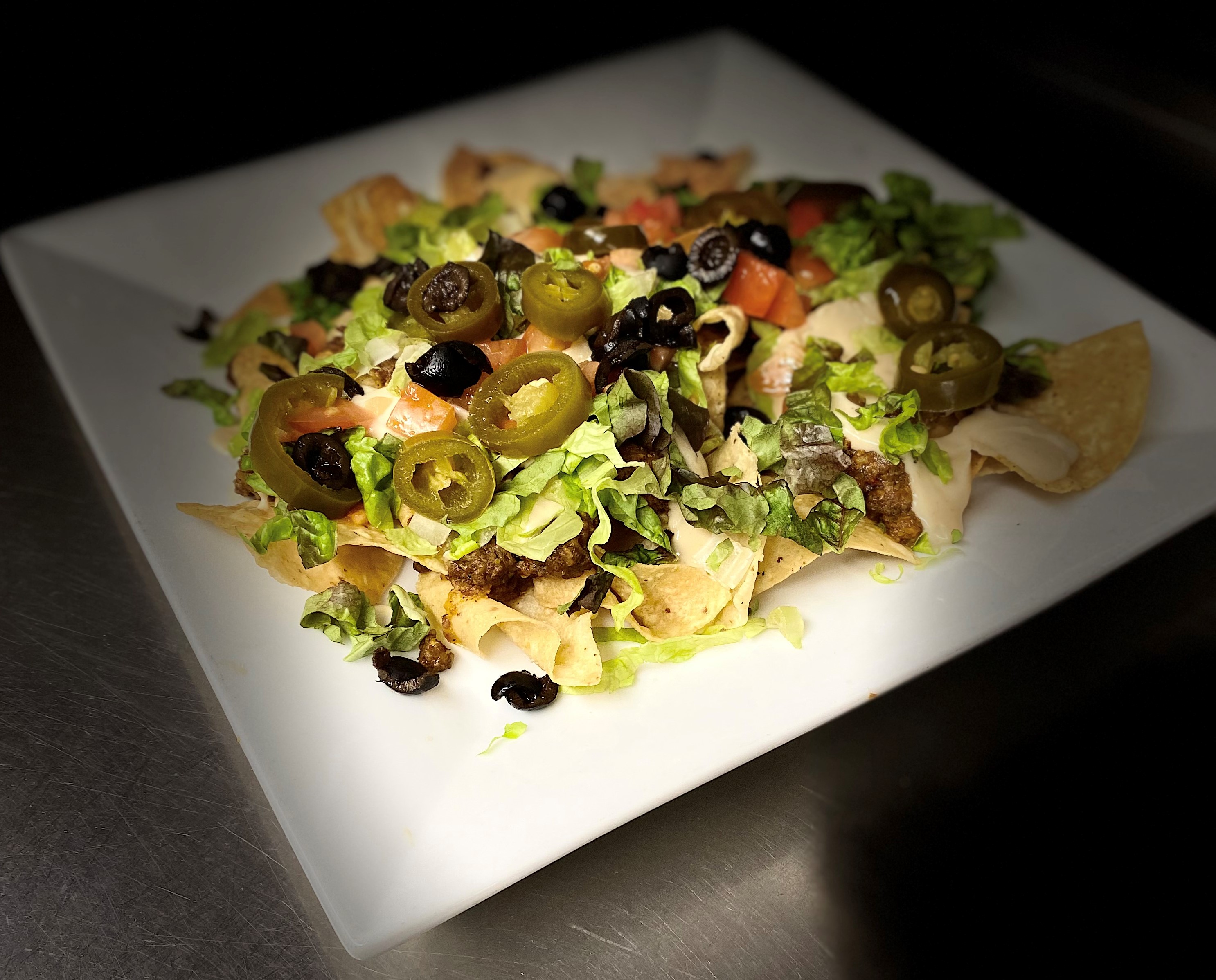 Order Nachos food online from Verde Lounge store, Sioux Falls on bringmethat.com