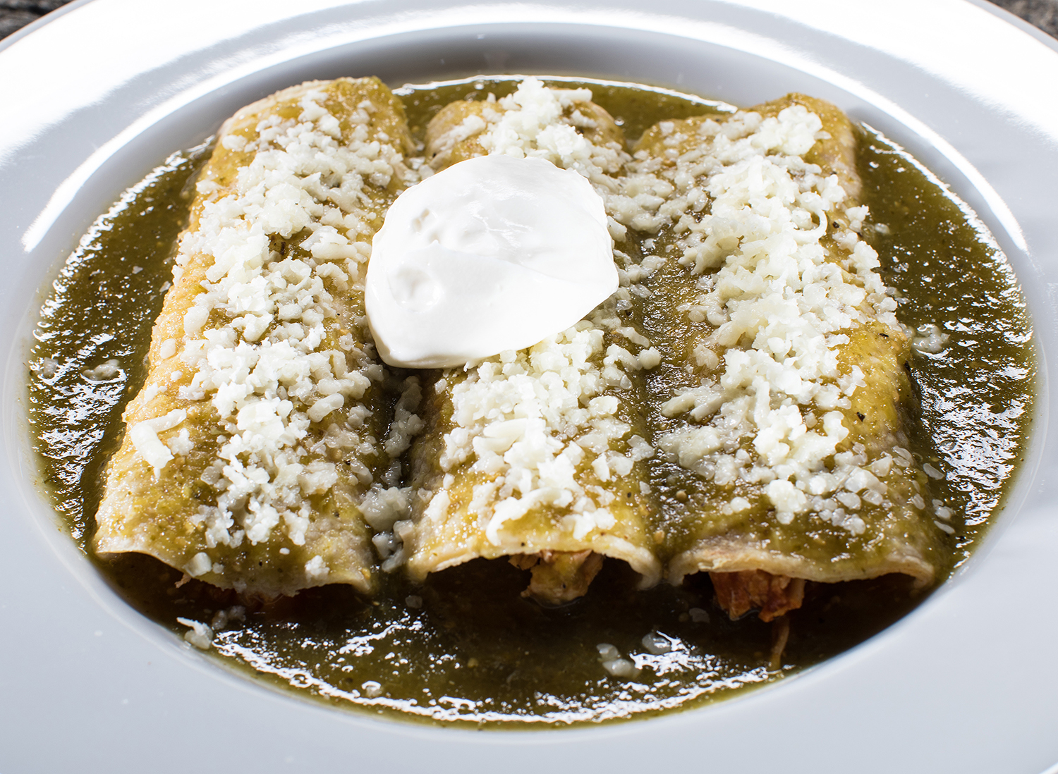 Order Chicken Tinga Enchiladas food online from Mixteco Mexican Grill store, Chicago on bringmethat.com