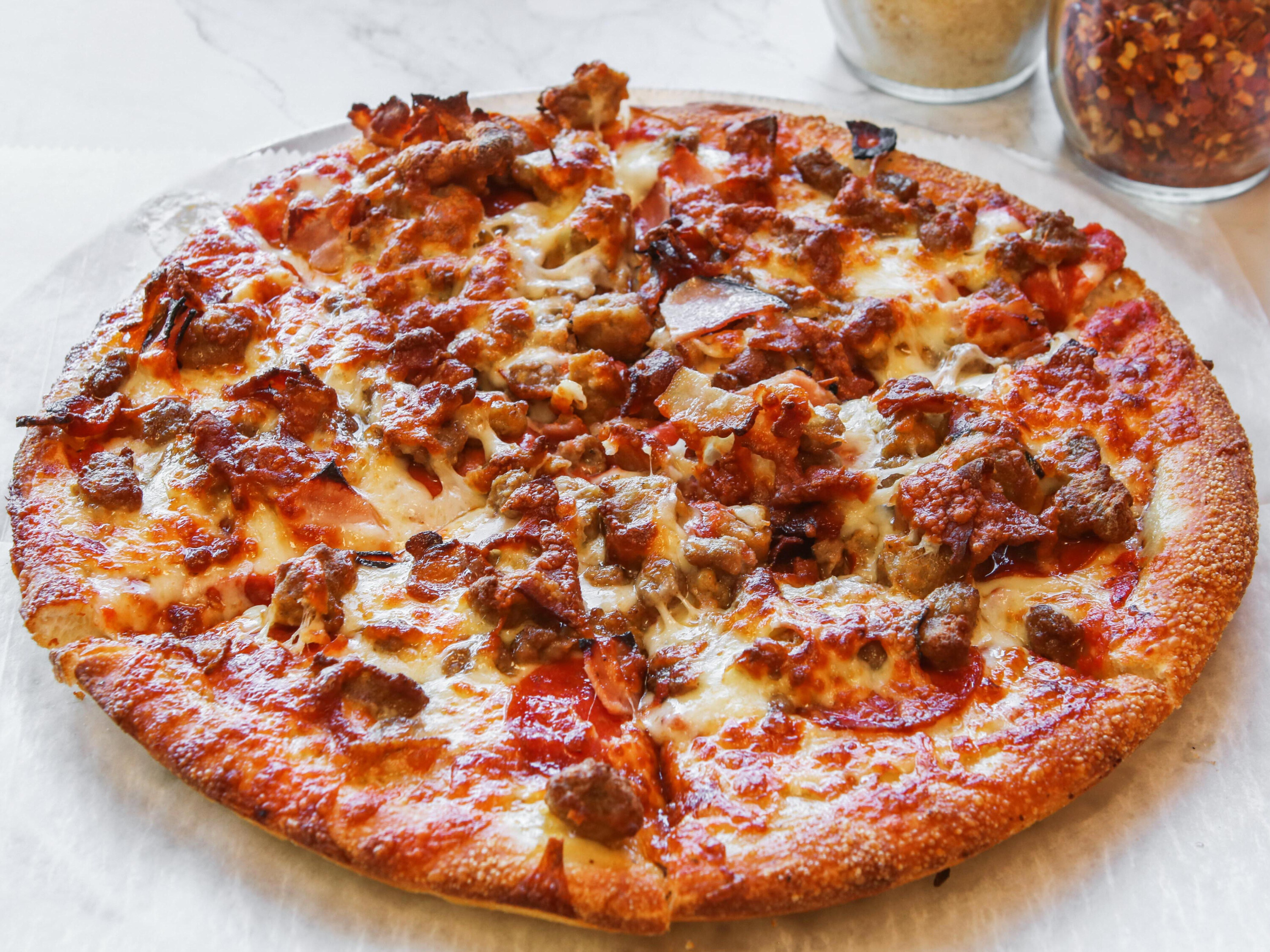 Order Meat Lovers Pizza food online from Primo Pizza store, Bellingham on bringmethat.com