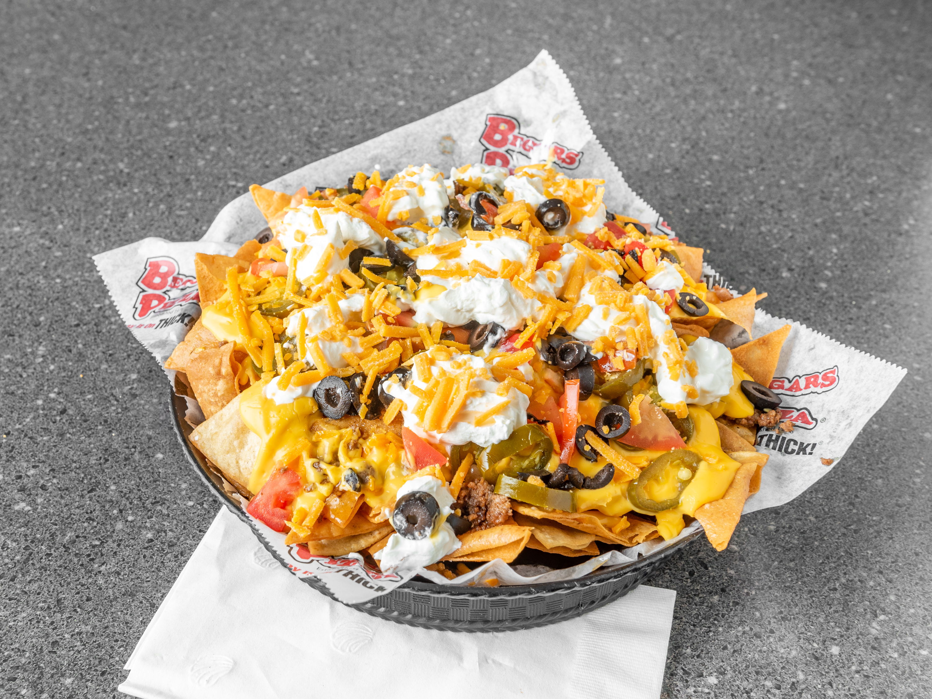 Order Loaded Nachos food online from Beggars Pizza store, Blue Island on bringmethat.com