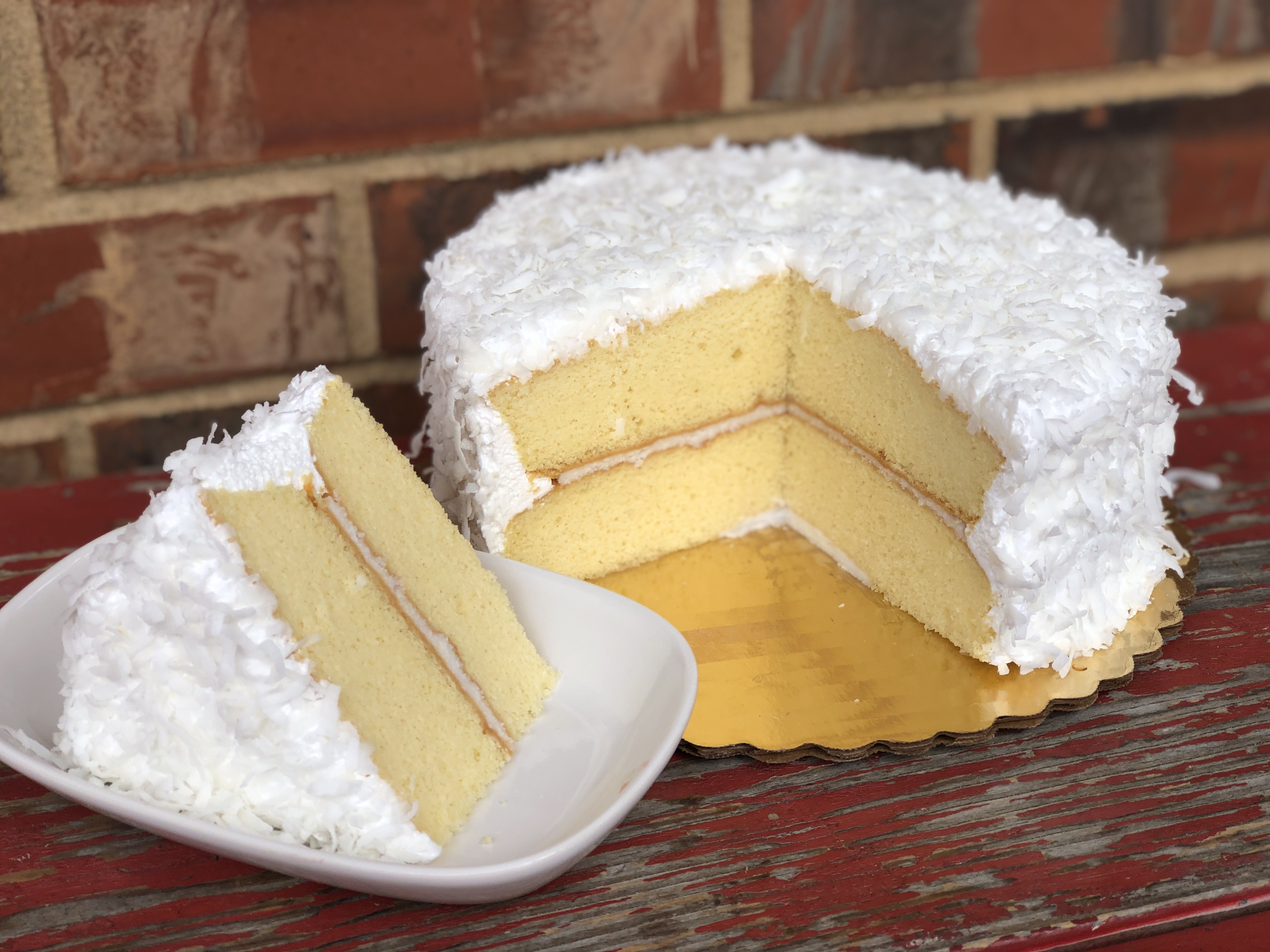 Order Coconut Cake food online from Mcentyre's Bakery store, Dallas on bringmethat.com