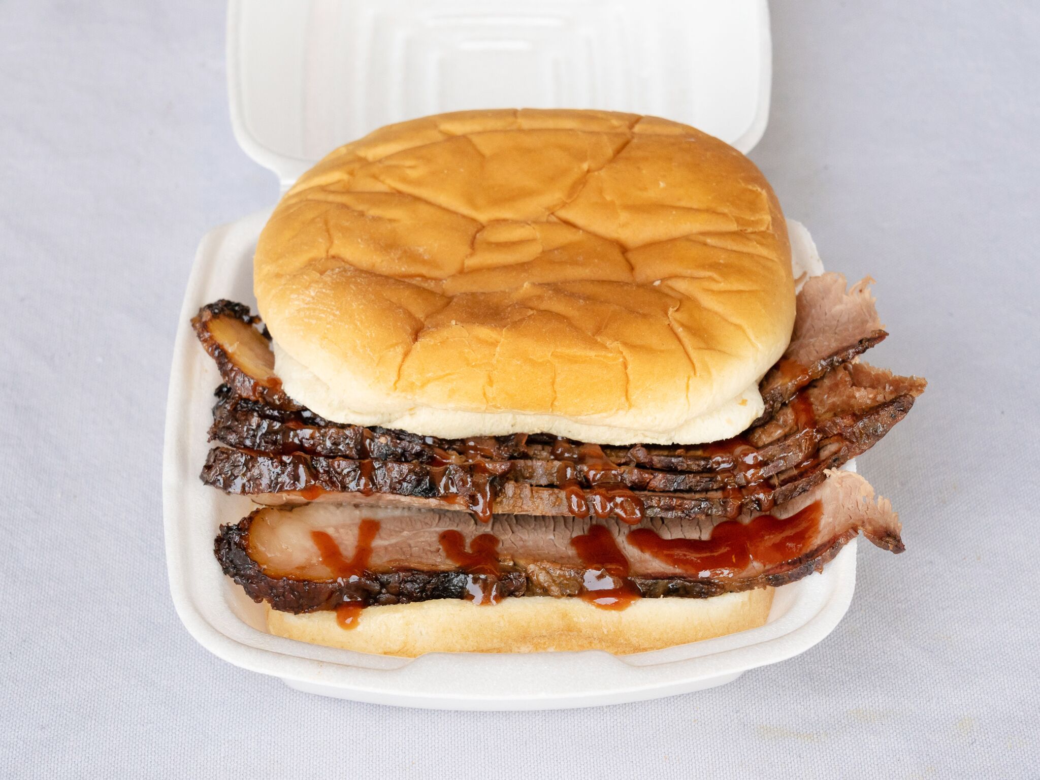 Order Sliced Brisket Sandwich food online from Guillorys Bar B Que store, Houston on bringmethat.com