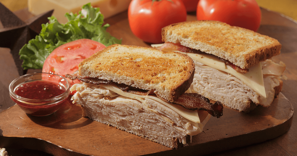 Order Smoked Turkey Club Sandwich food online from Colton Steakhouse & Grill store, Collinsville on bringmethat.com