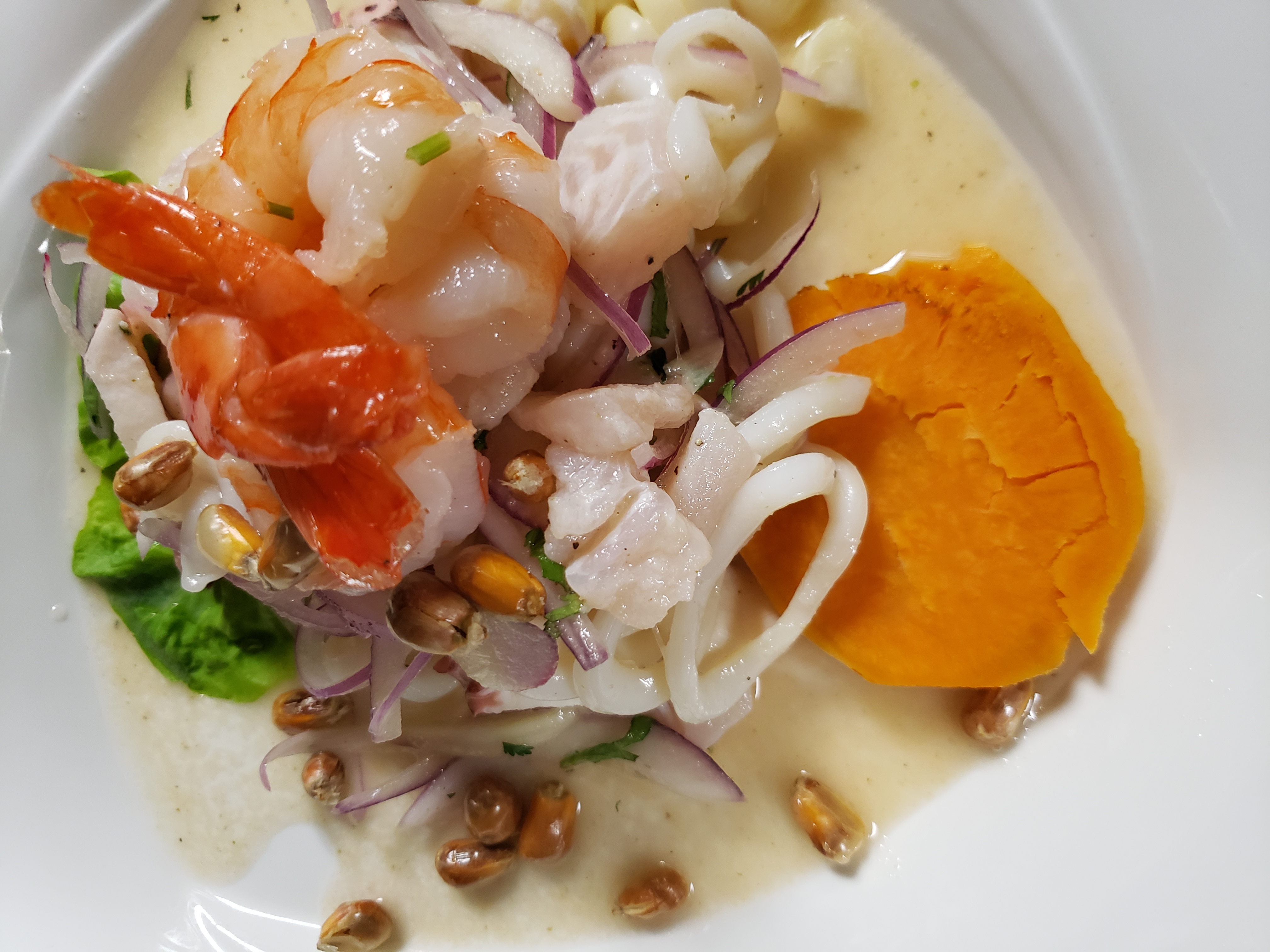 Order Ceviche Mixto food online from Inti Peruvian Cuisine store, New York on bringmethat.com