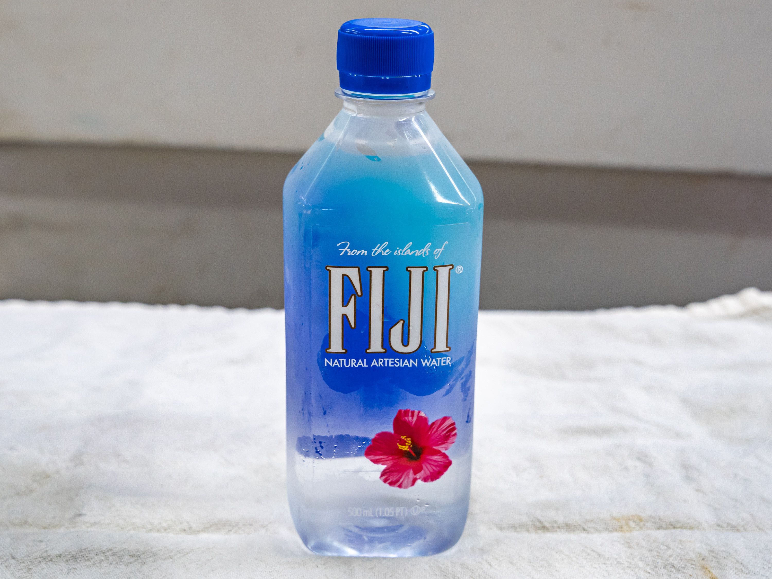 Order Fiji water - 16oz food online from Quentin Deli and Grocery store, Brooklyn on bringmethat.com