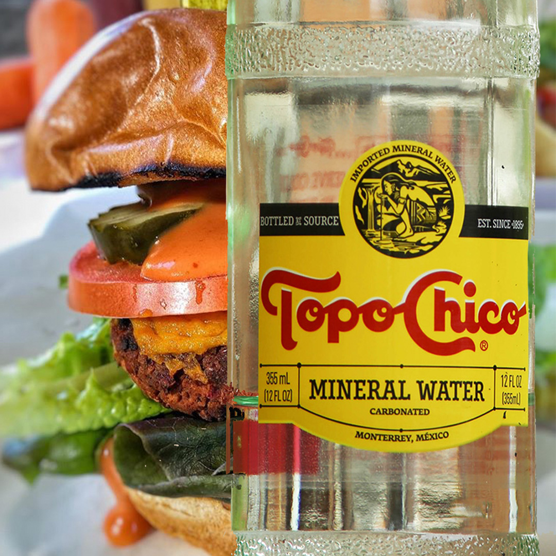 Order Topo Chico Sparkling Mineral Water (large 16.9 oz bottle) food online from Bubbie Plant Burgers store, Washington on bringmethat.com